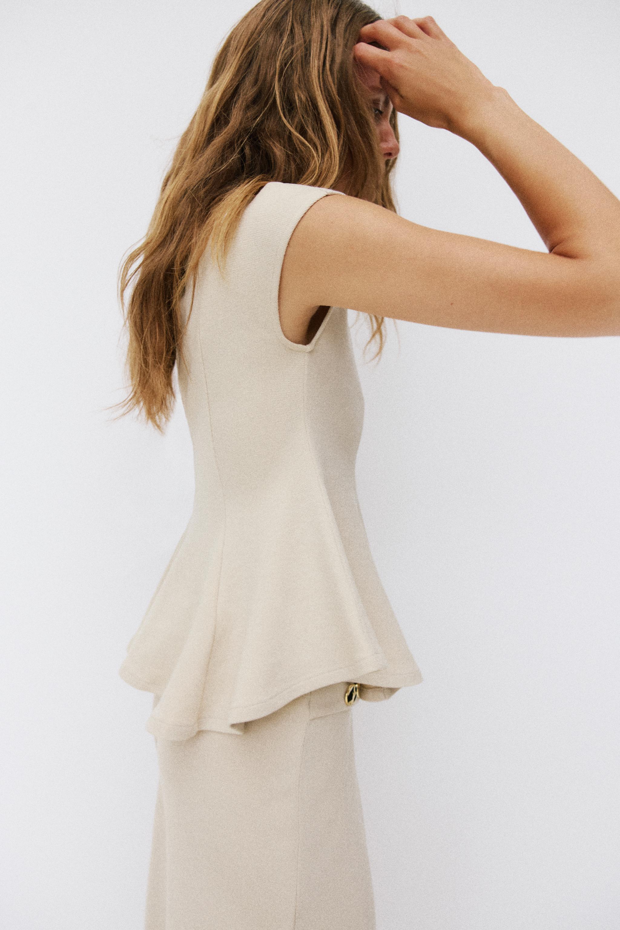 SHORT SLEEVE PIQUÉ PEPLUM TOP