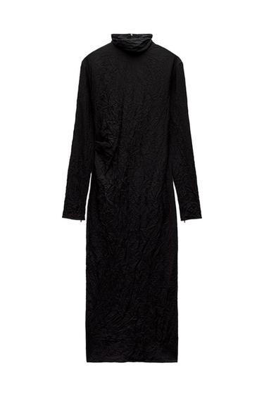 Front view of a black long-sleeved dress with a crinkled texture.