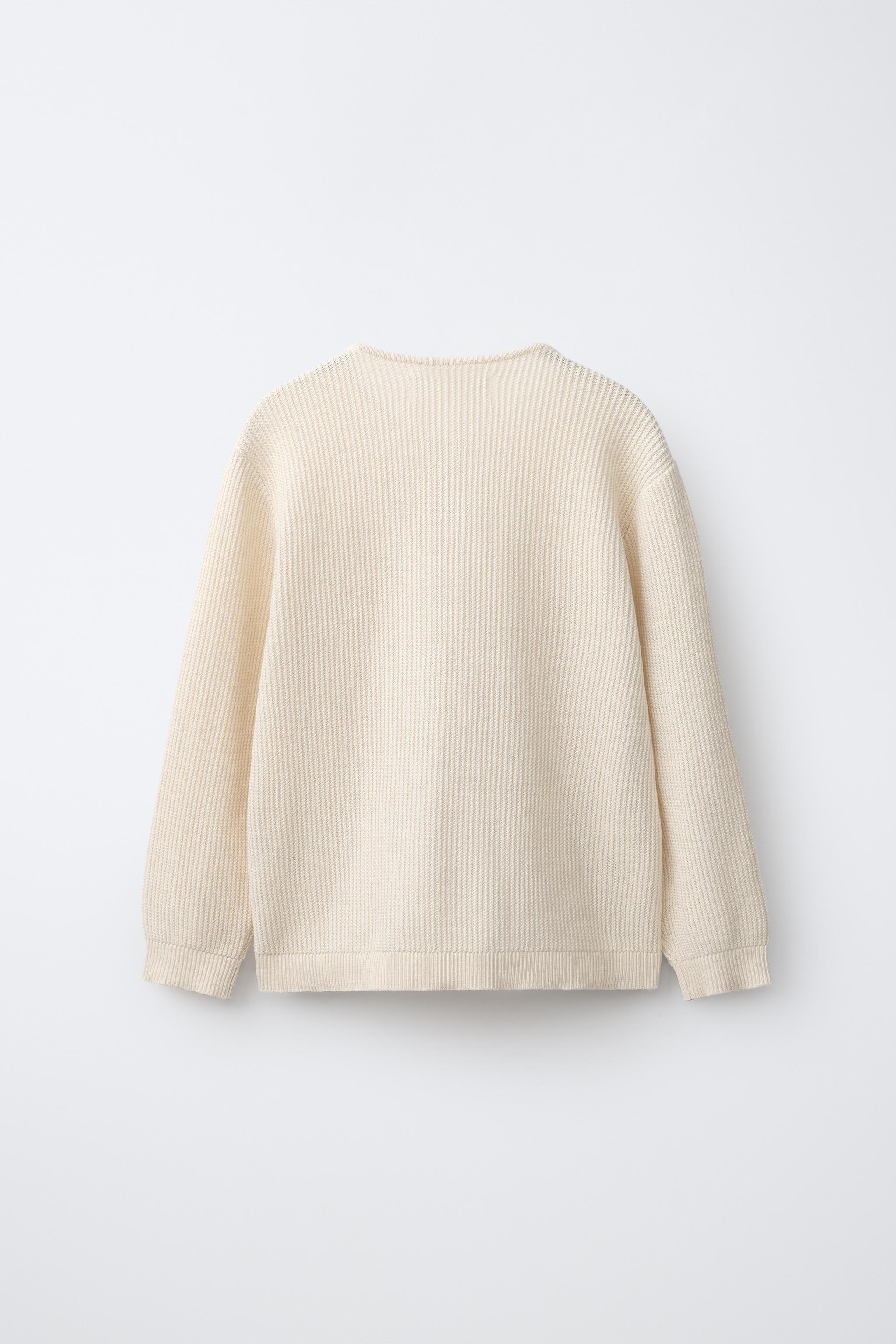 PULL EN MAILLE À COL MONTANT