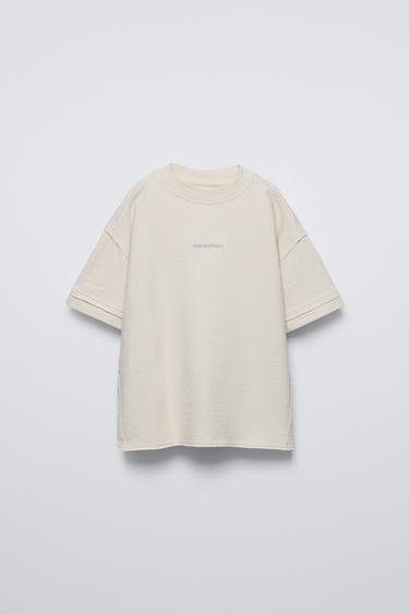 Zara Round neck T-shirt with short sleeves. Front embroidery detail and back label appliqué. - Oyster-white