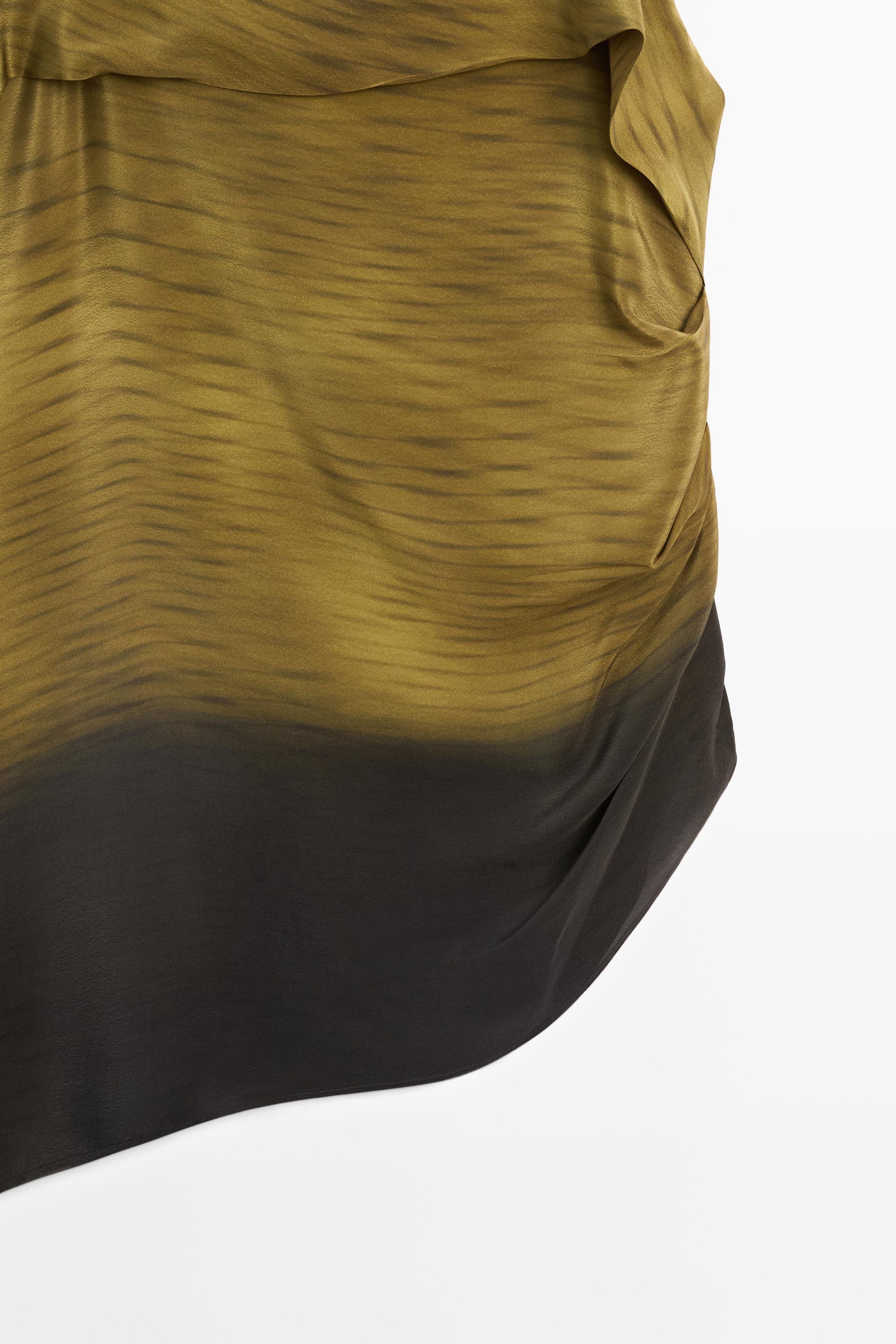 Asymmetric strappy top with draped detail