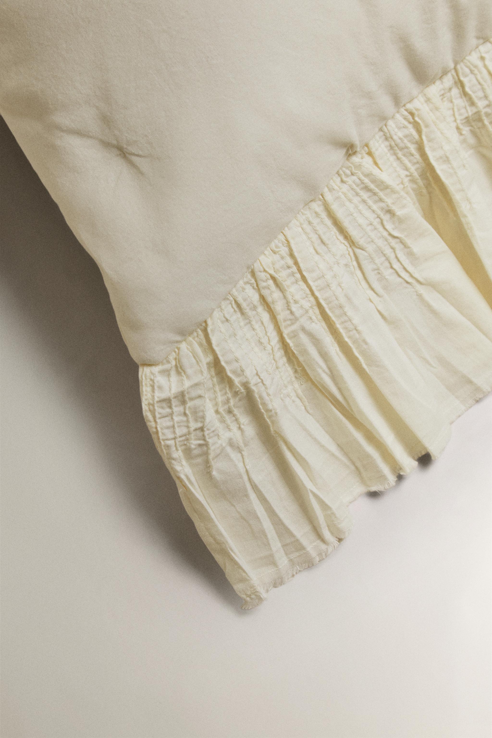 COTTON QUILTED CUSHION COVER WITH RUFFLE TRIM — Oyster-white