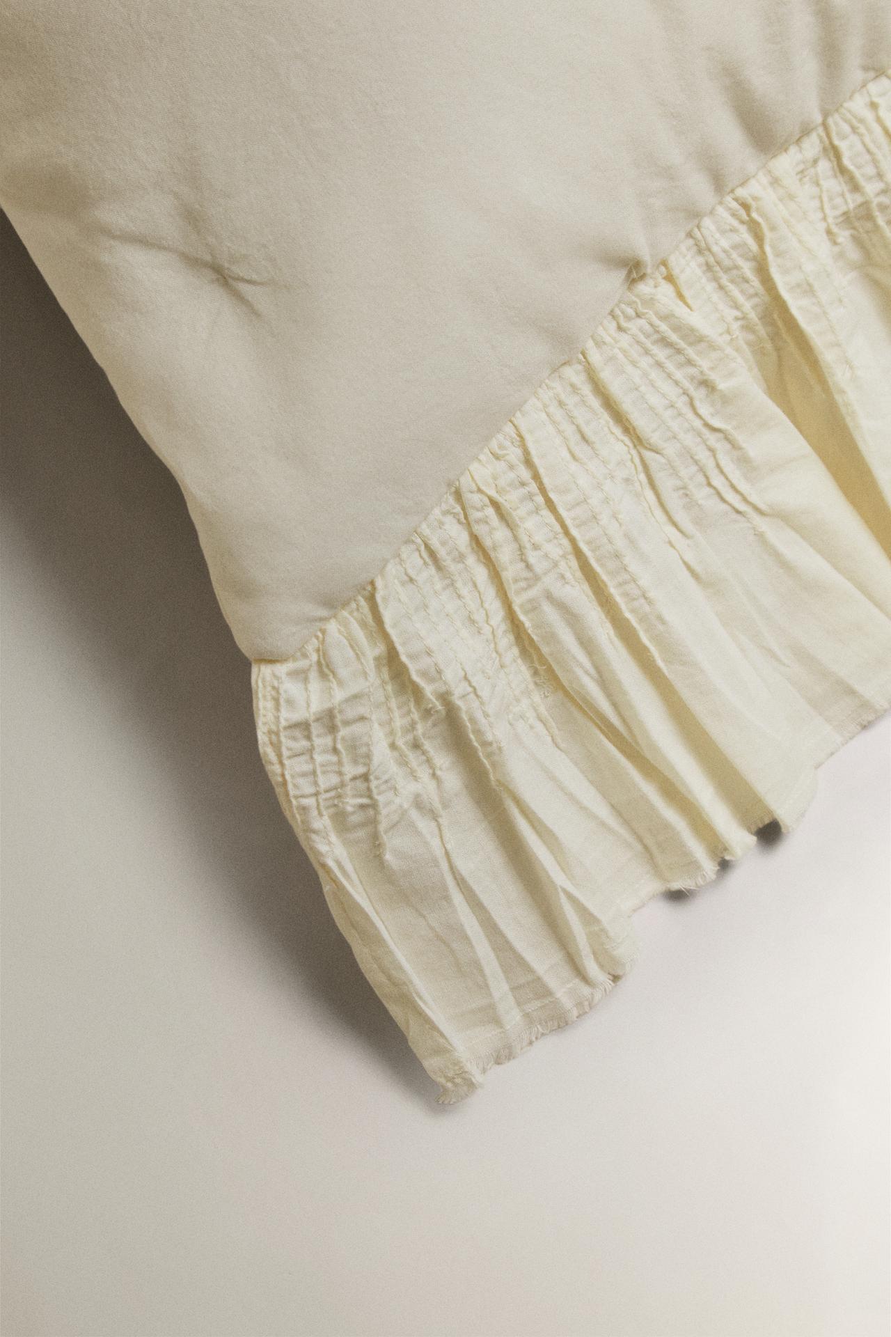 COTTON QUILTED CUSHION COVER WITH RUFFLE TRIM — Oyster-white