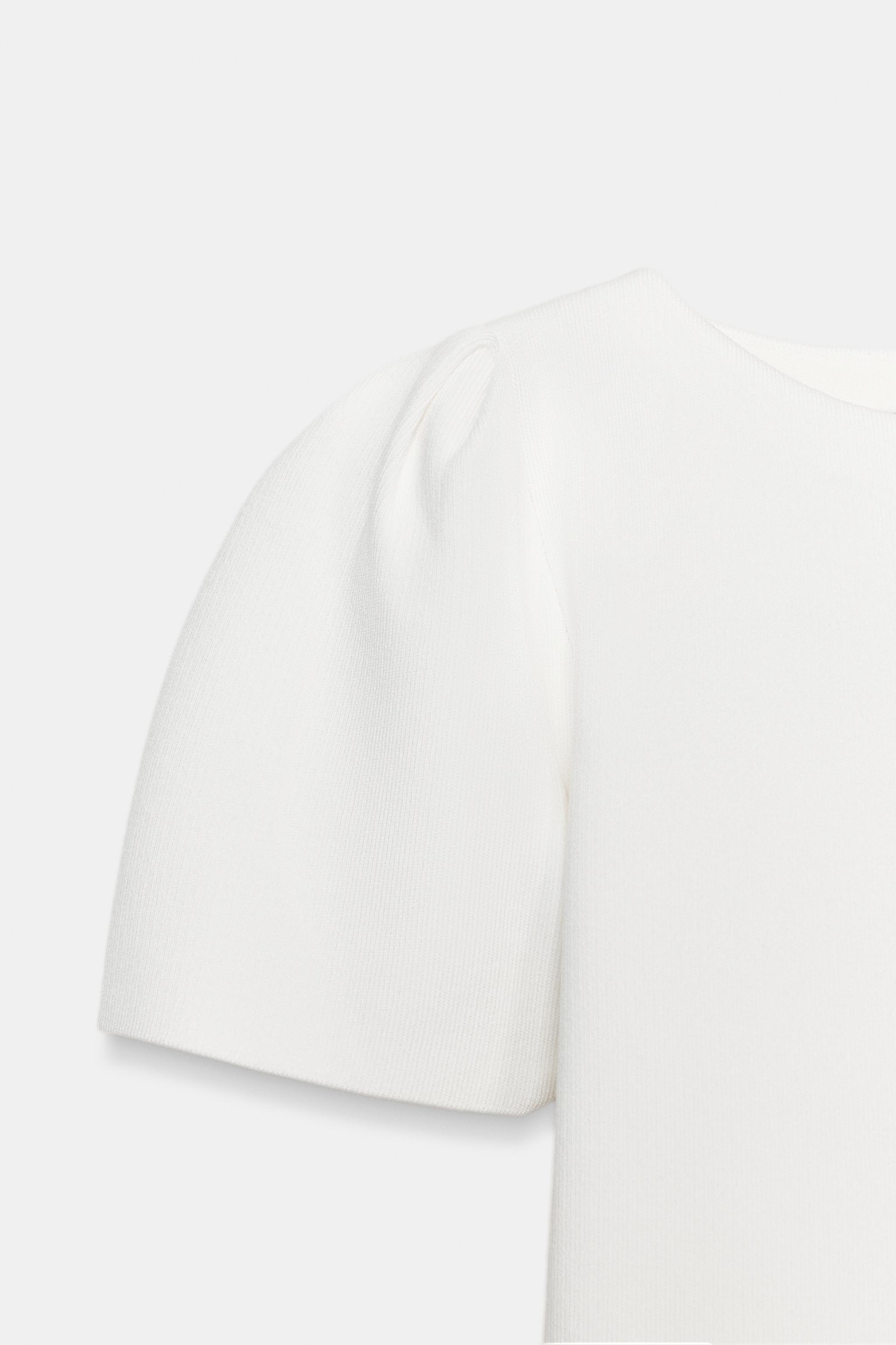 TOP EN MAILLE À MANCHES BOUFFANTES