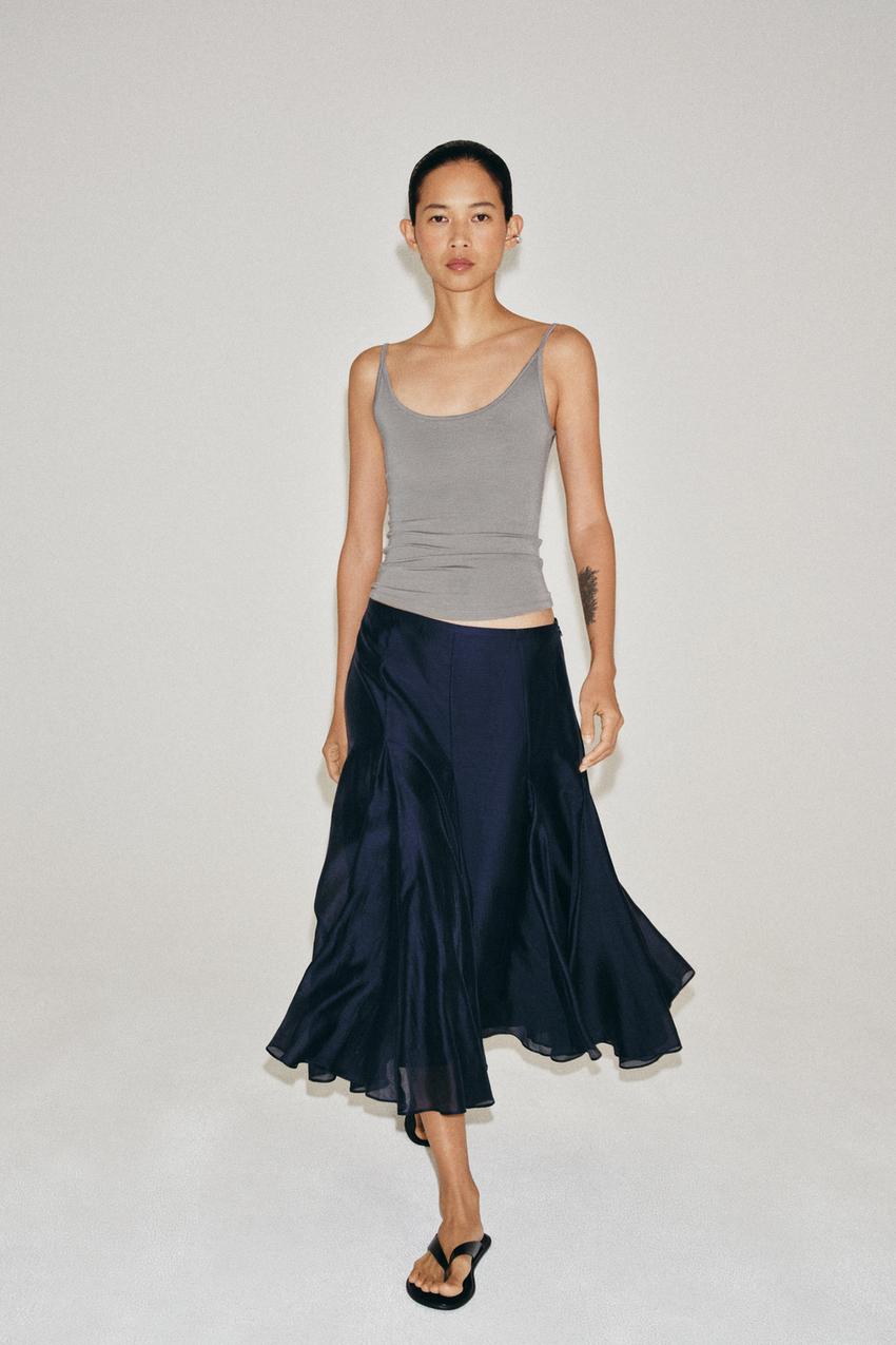 Gray tank top and navy blue mid-rise maxi skirt set, A-line silhouette with panels and a flared hem.