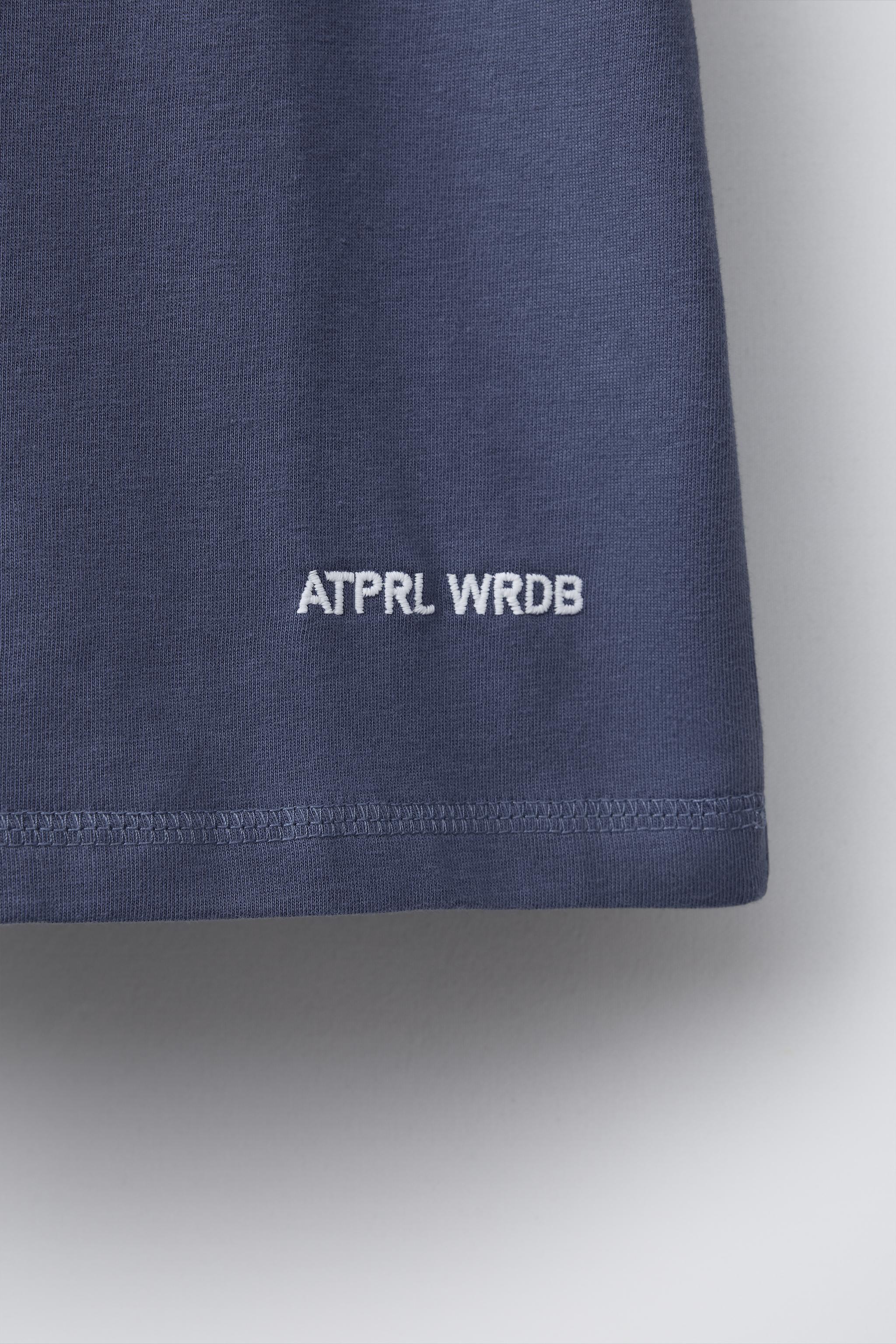 PLAIN T-SHIRT WITH EMBROIDERED TEXT