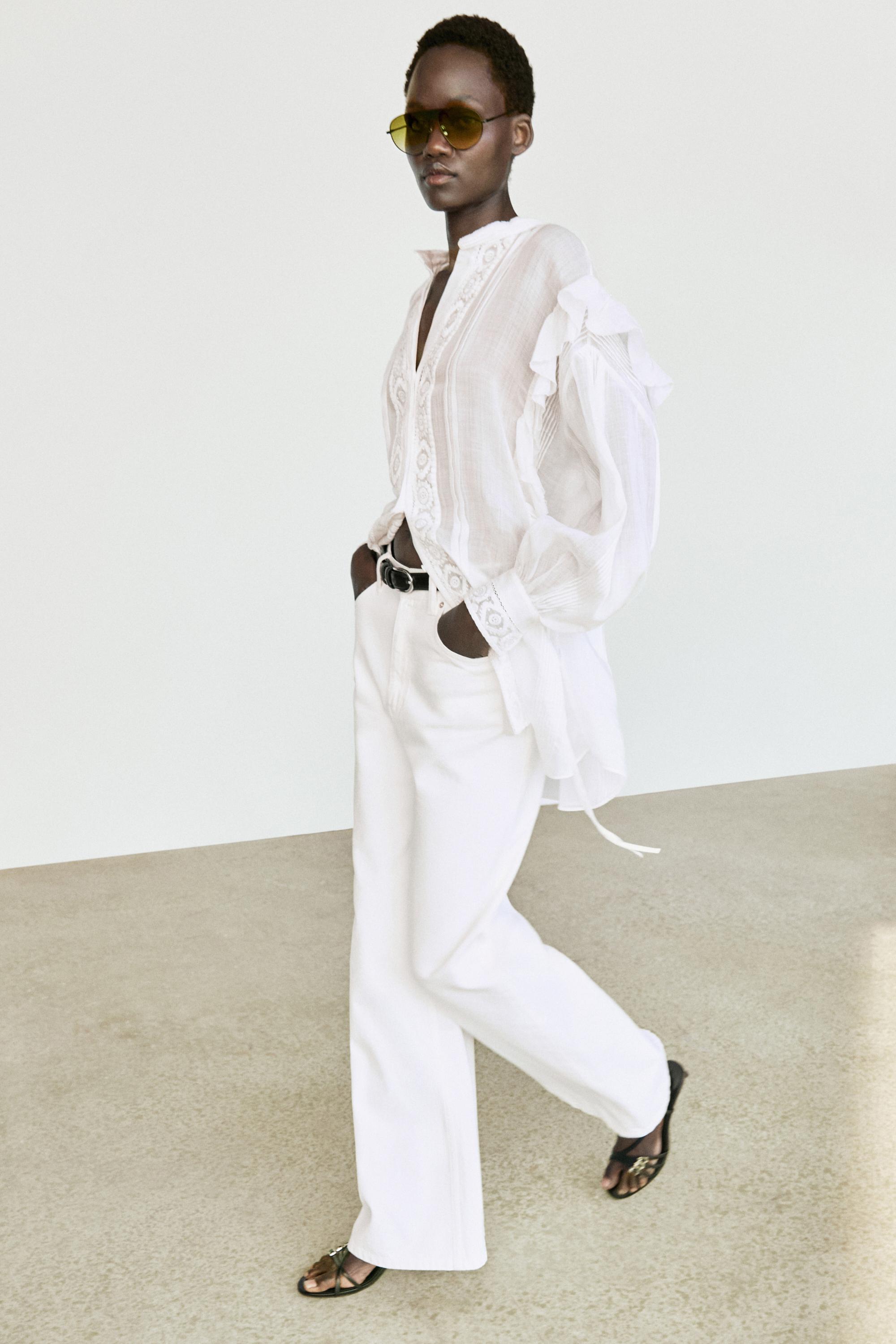 Stand collar blouse with embroidery and ruffles — White