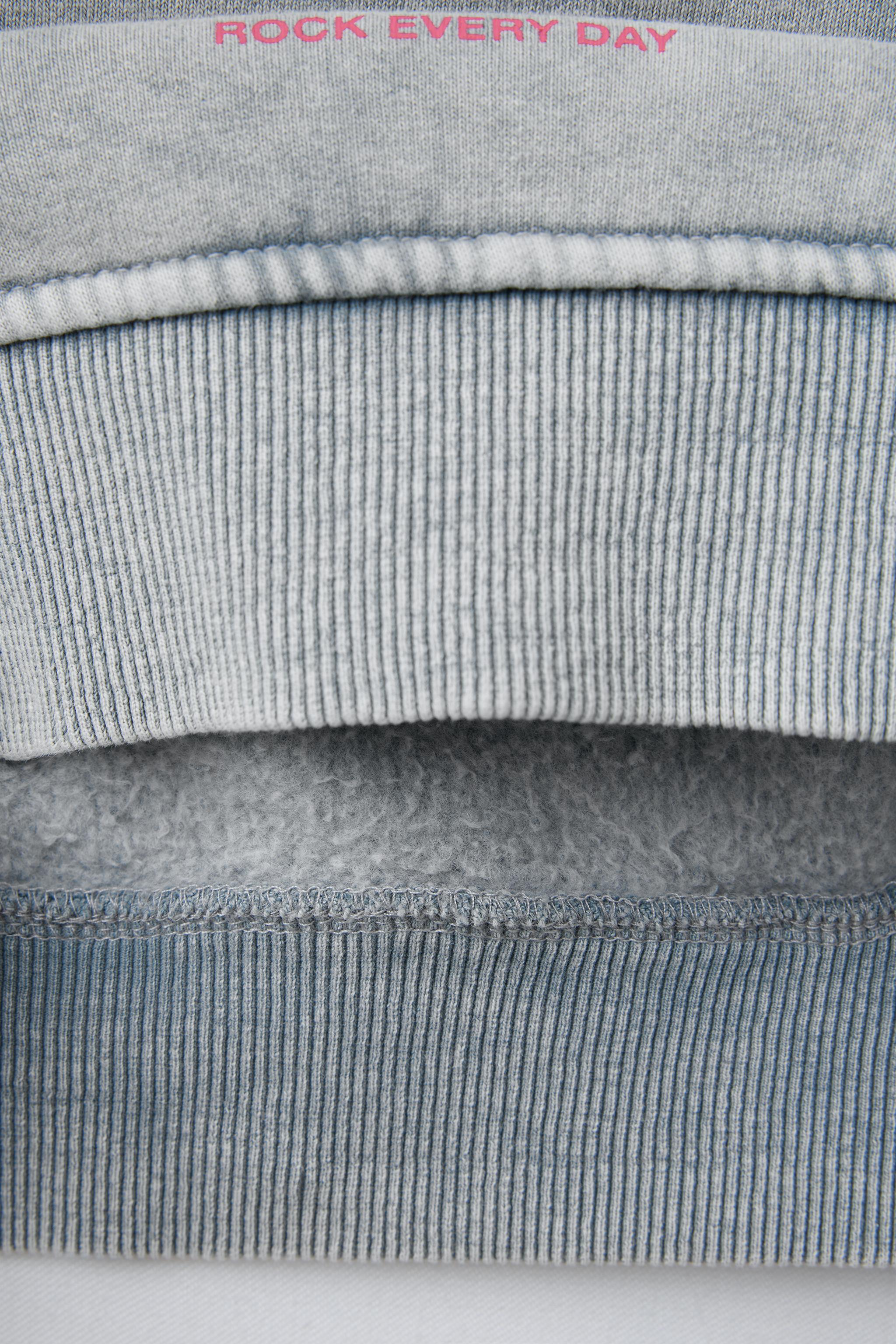 SWEAT EFFET DÉLAVÉ ÉTOILE BRILLANT