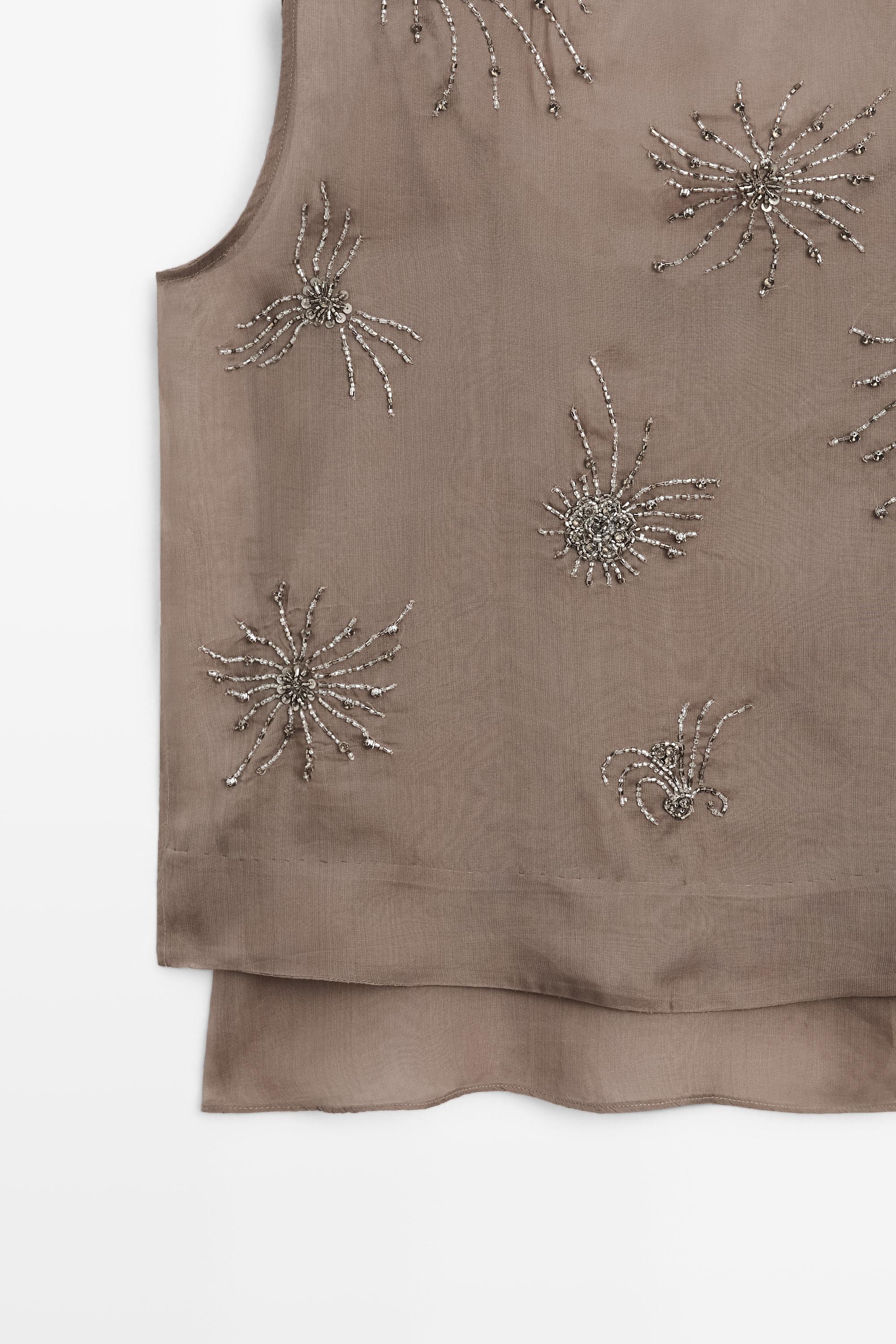 Semi-sheer top with embroidered detail