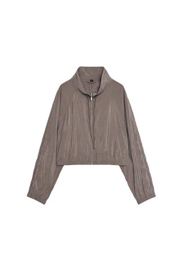 Front view of a brown zip-up jacket with a high neck.