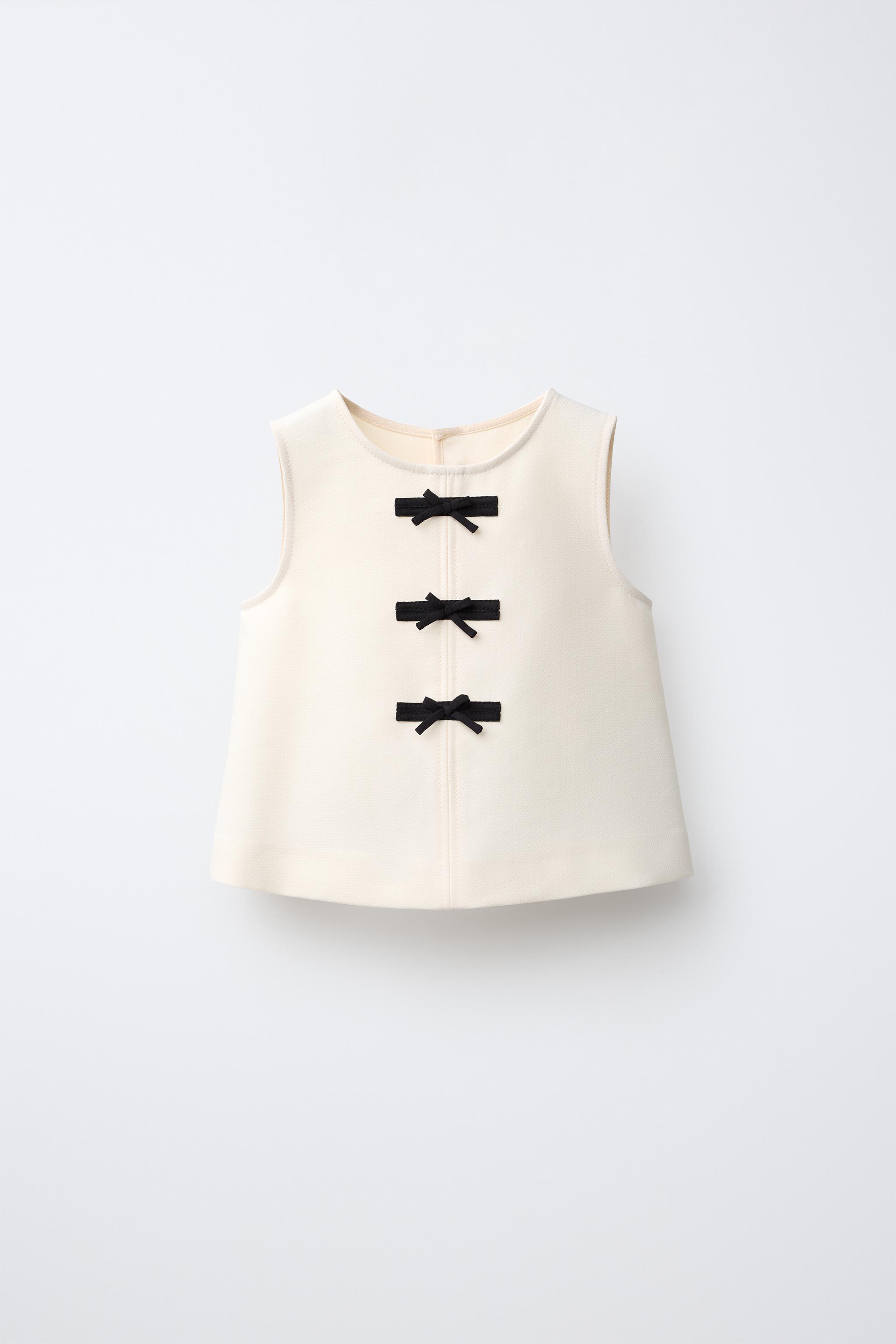 BOW APPLIQUÉ TOP — Ecru