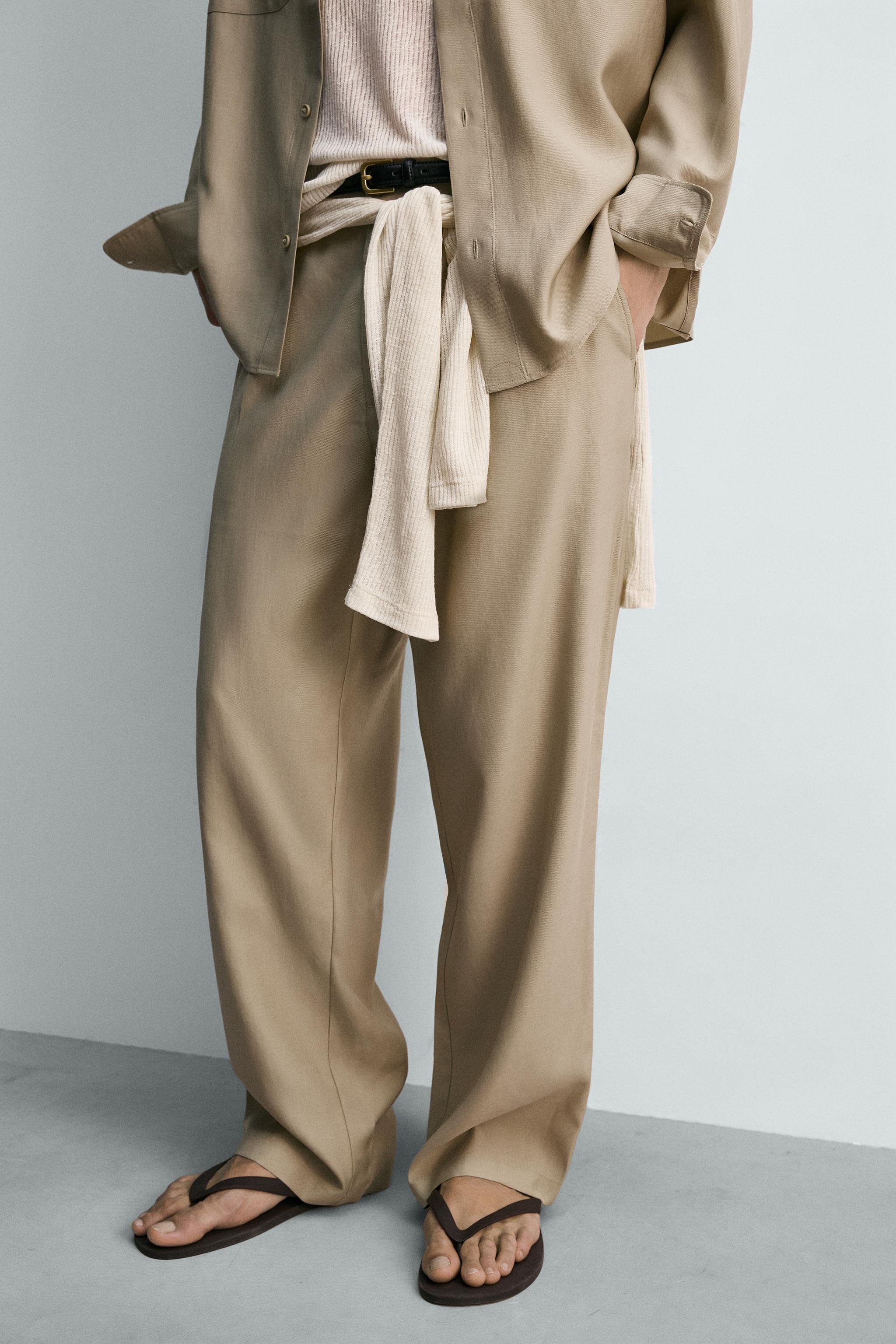 FLOWY PLEATED PANTS