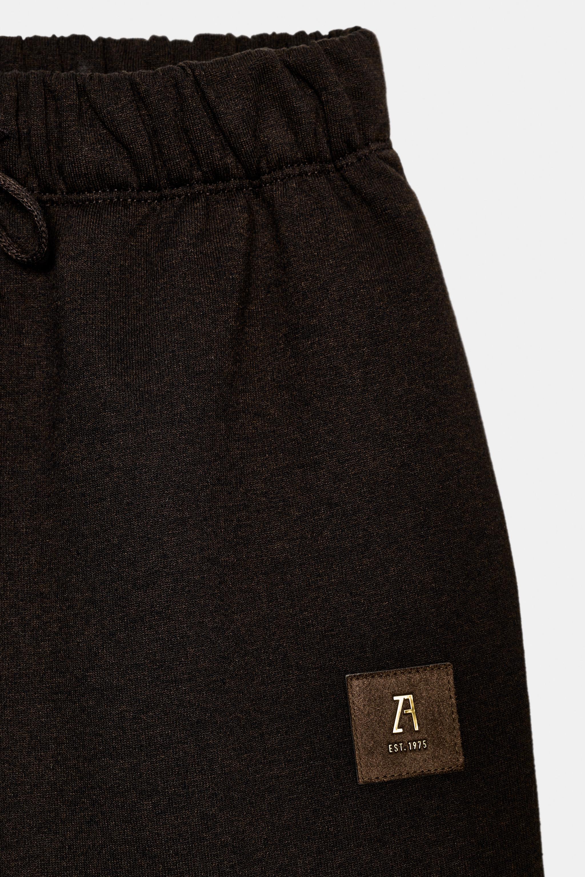 PANTALON EN MOLLETON AVEC PIÈCE