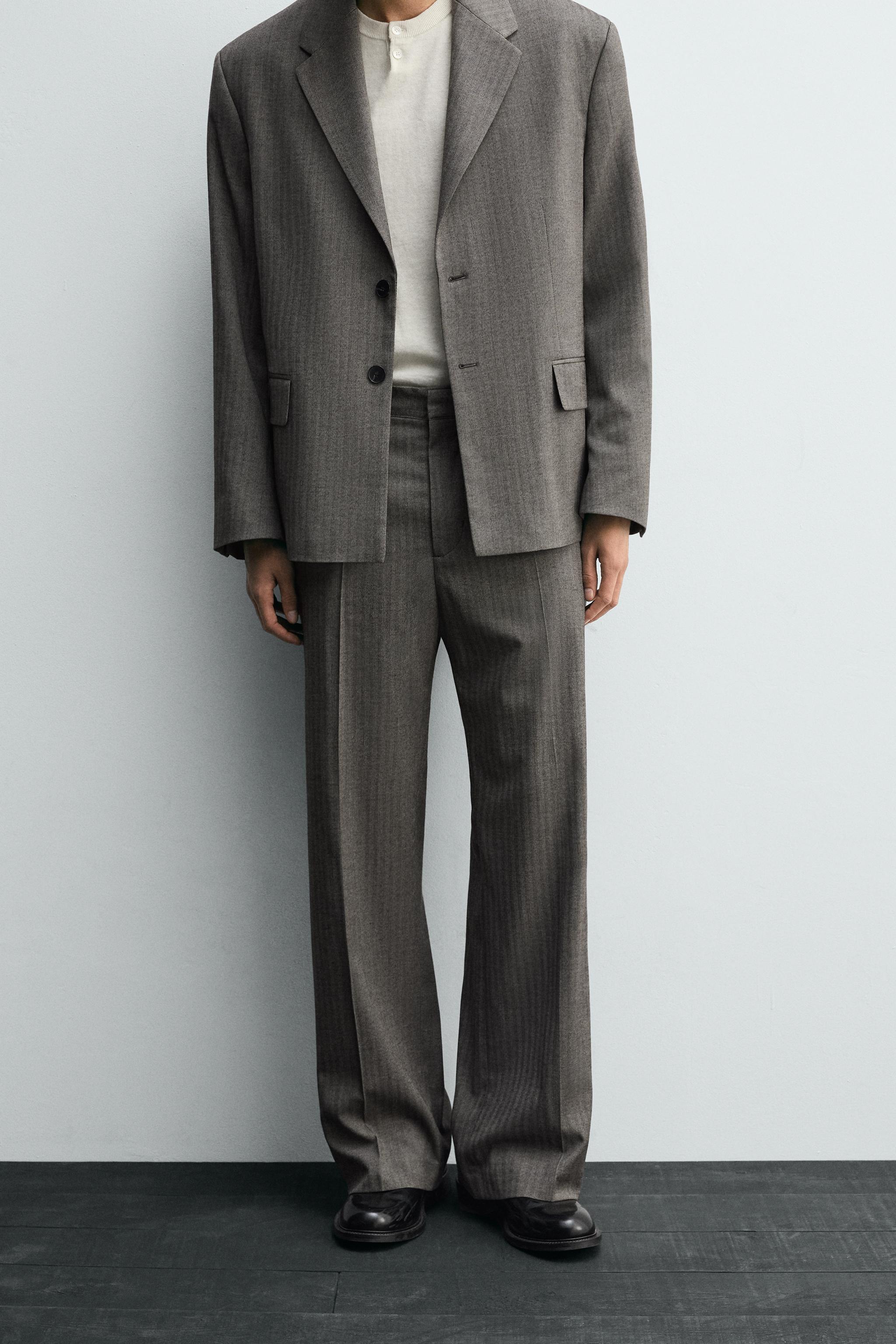 HERRINGBONE SUIT FLARE FIT PANTS