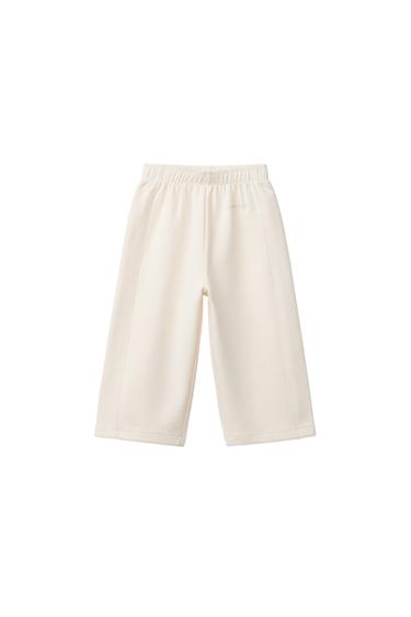 WIDE-LEG INTERLOCK TROUSERS WITH RAISED SLOGAN - Mid-ecru by Zara