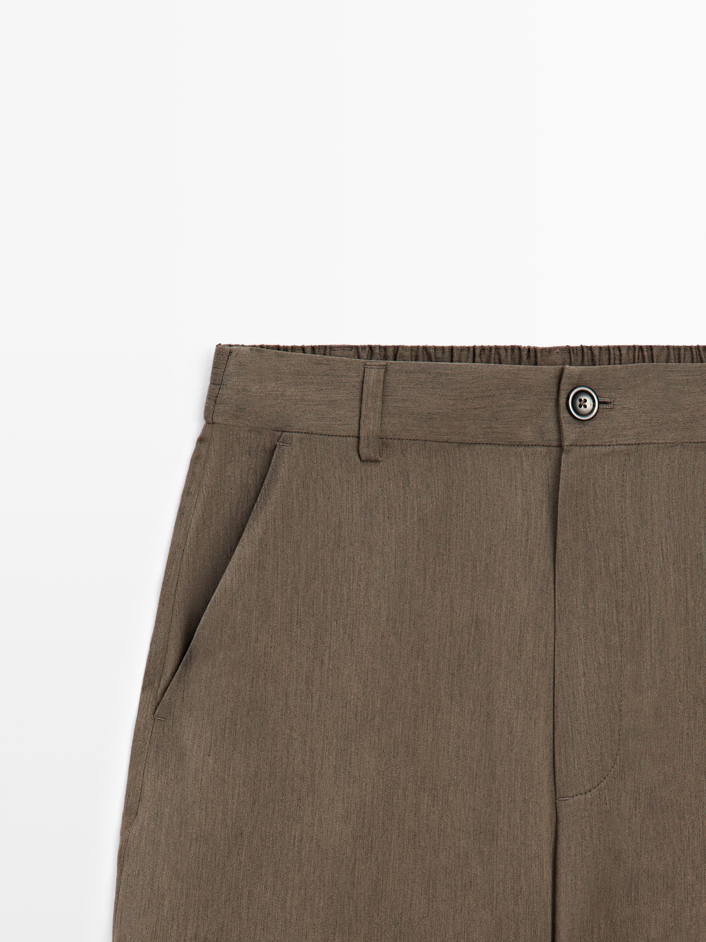 Flowing trousers with elasticated waistband