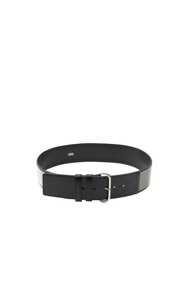 Front view of black belt with metal buckle and side texture detail.