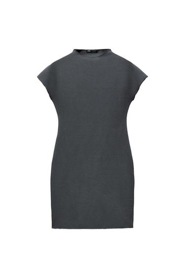 Dark grey fitted short dress with a high neck and short sleeves, against a white background.