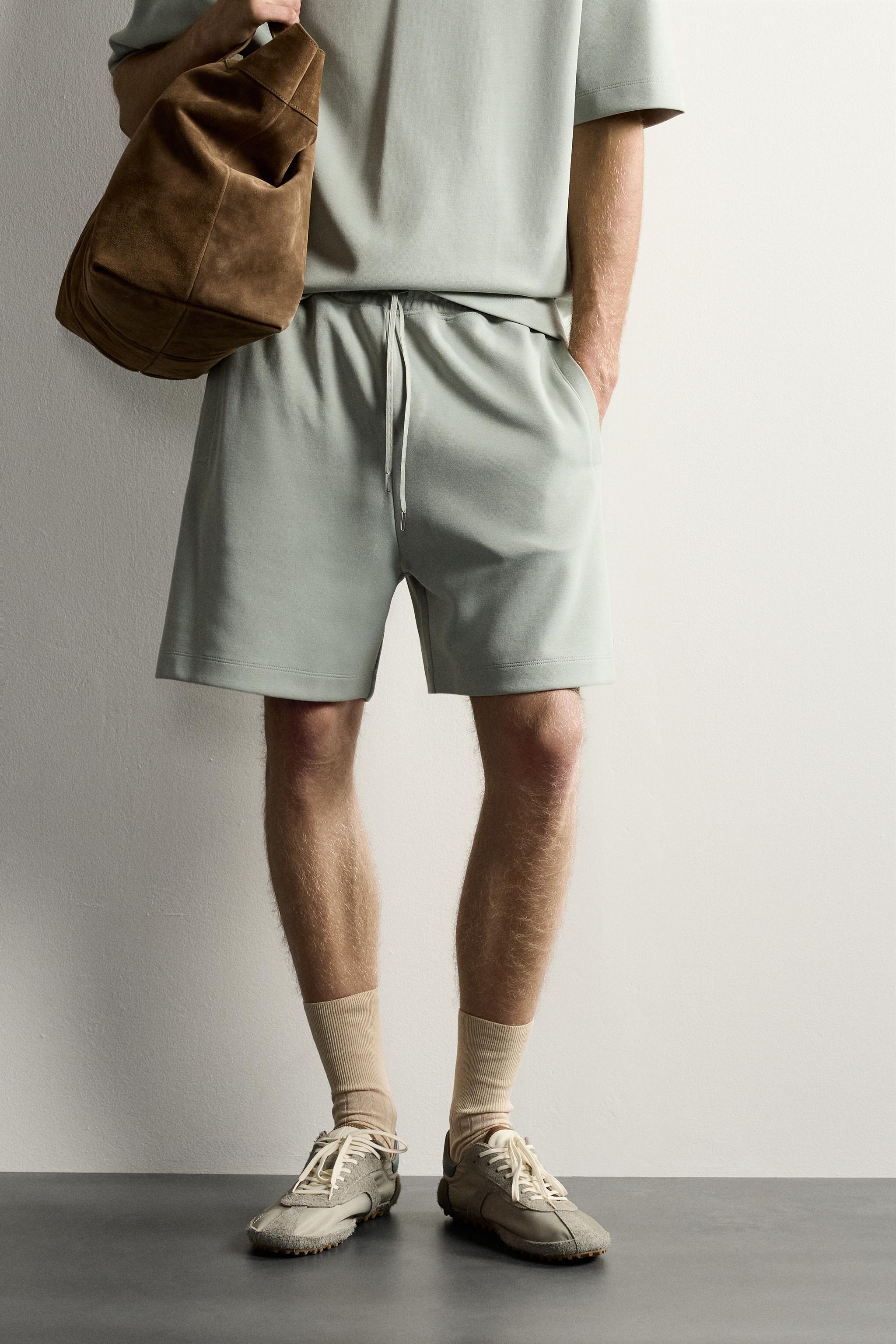 RELAXED FIT INTERLOCK TRACK SHORTS — Washed green