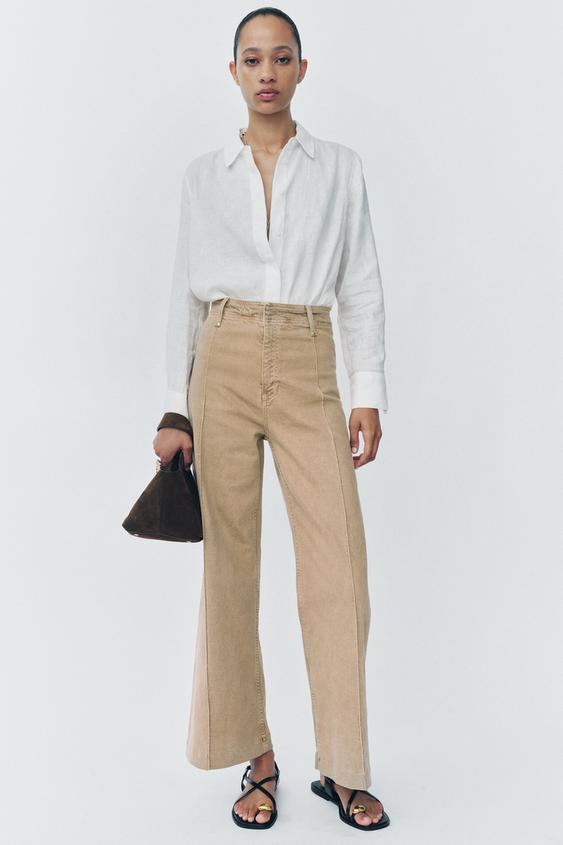 FLAT STRAPPY SANDALS WITH METAL ORNAMENT