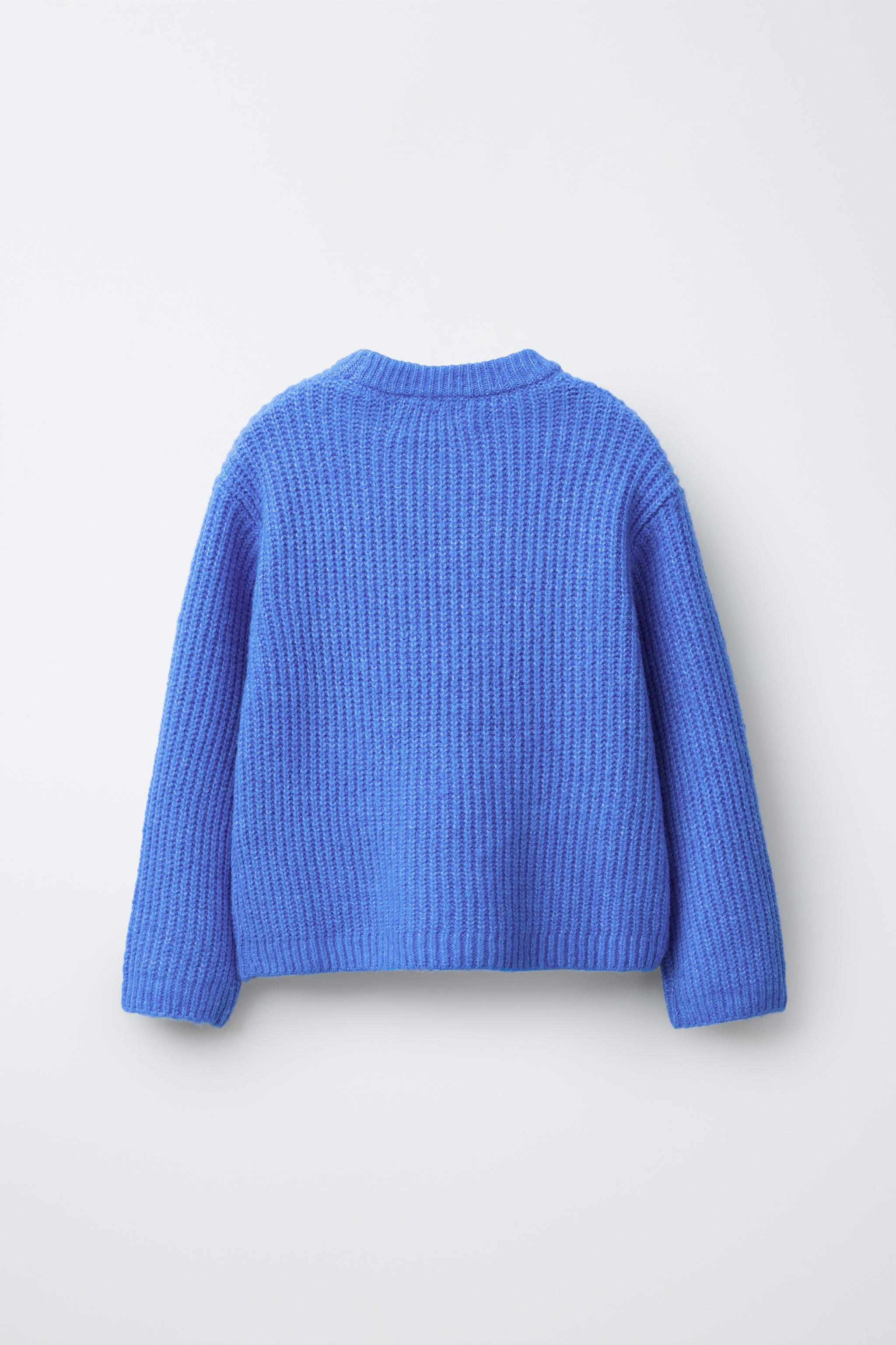 STRICKPULLOVER MIT SCHMUCKPERLEN, SCHLEIFEN UND GLITZER Blau