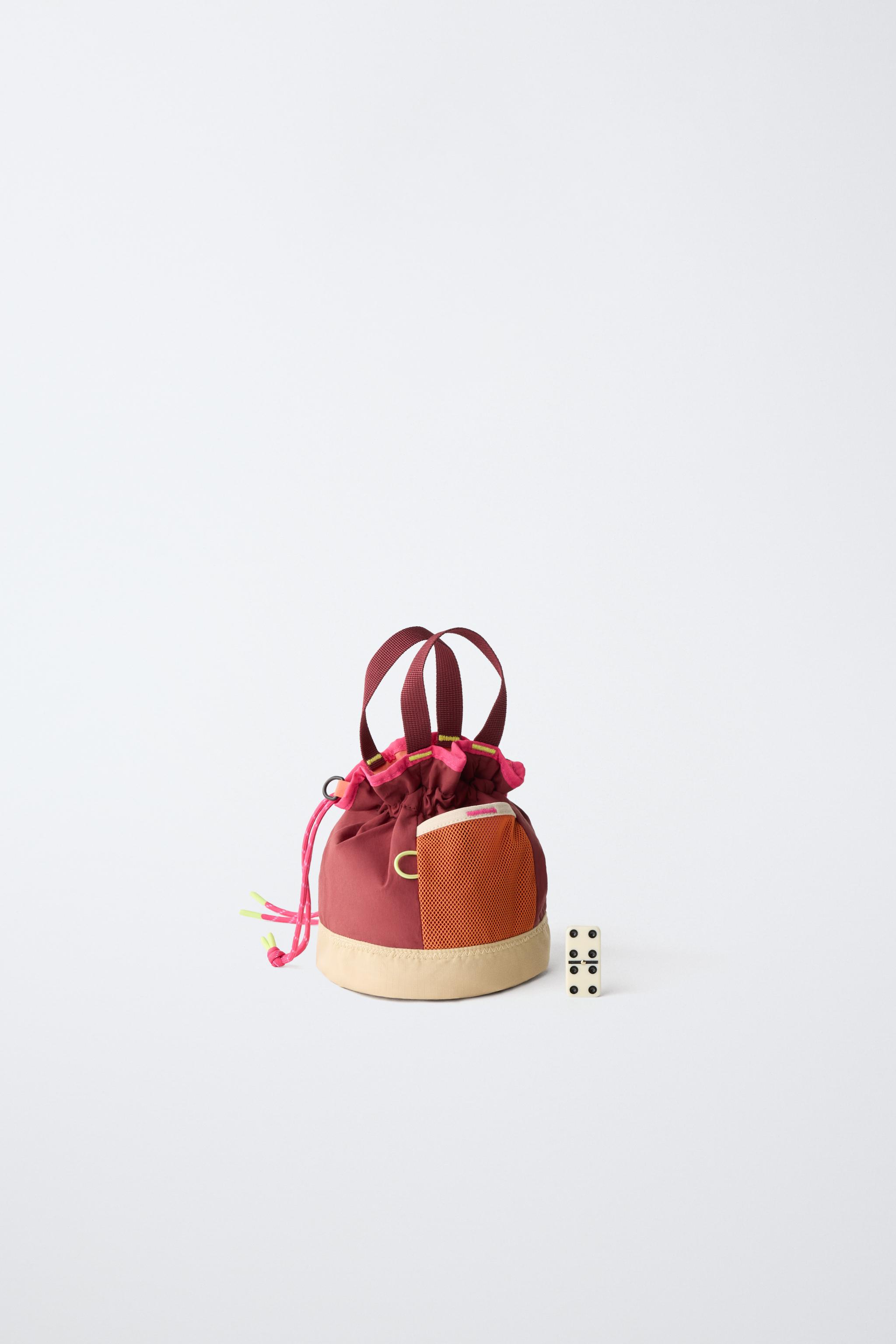MULTICOLOR TECHNICAL BUCKET BAG