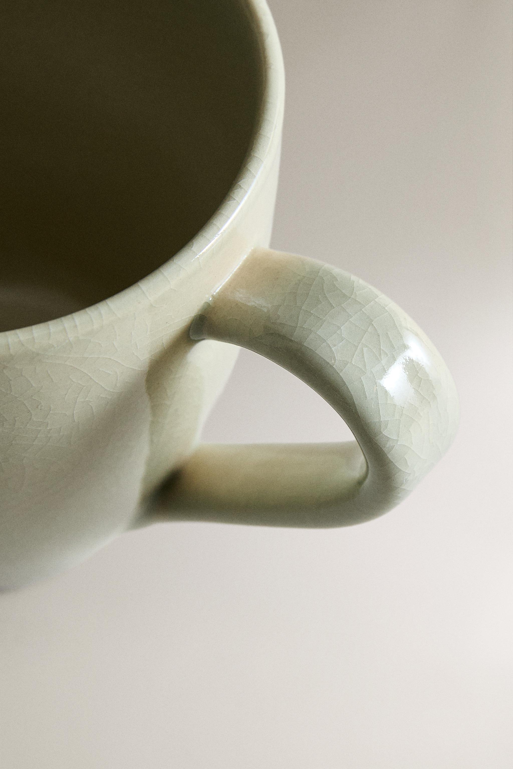 ENAMELED STONEWARE MUG