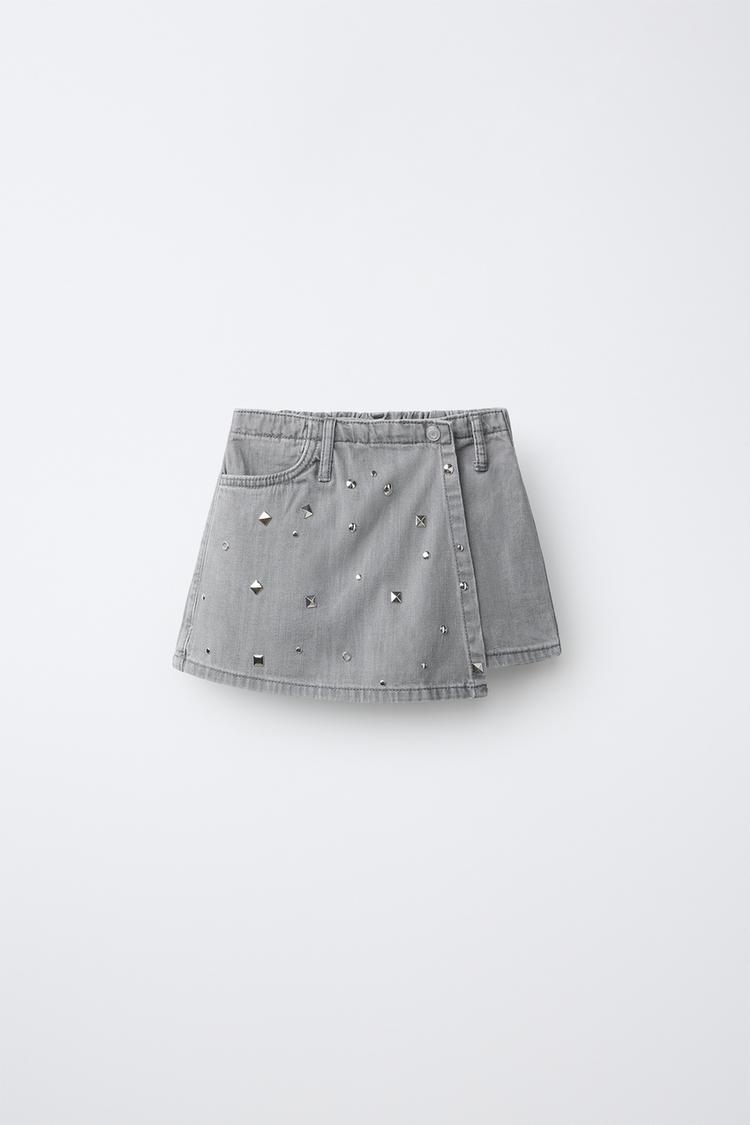 Falda bermuda denim tachas