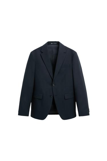 Front view of navy jacket with lapels and front flap pockets.