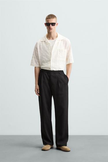 PANTALÓN FLUIDO PLIEGUES - Negro de Zara - Imagen 0