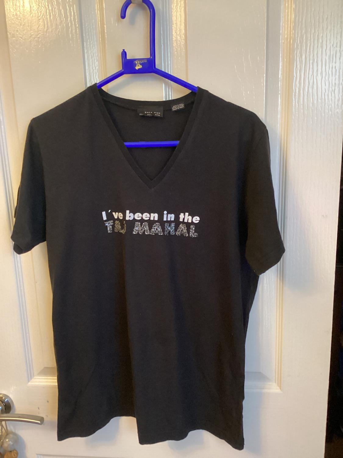 Front view of a black t-shirt with 'I've been in the TAJ MAHAL' text on the chest.