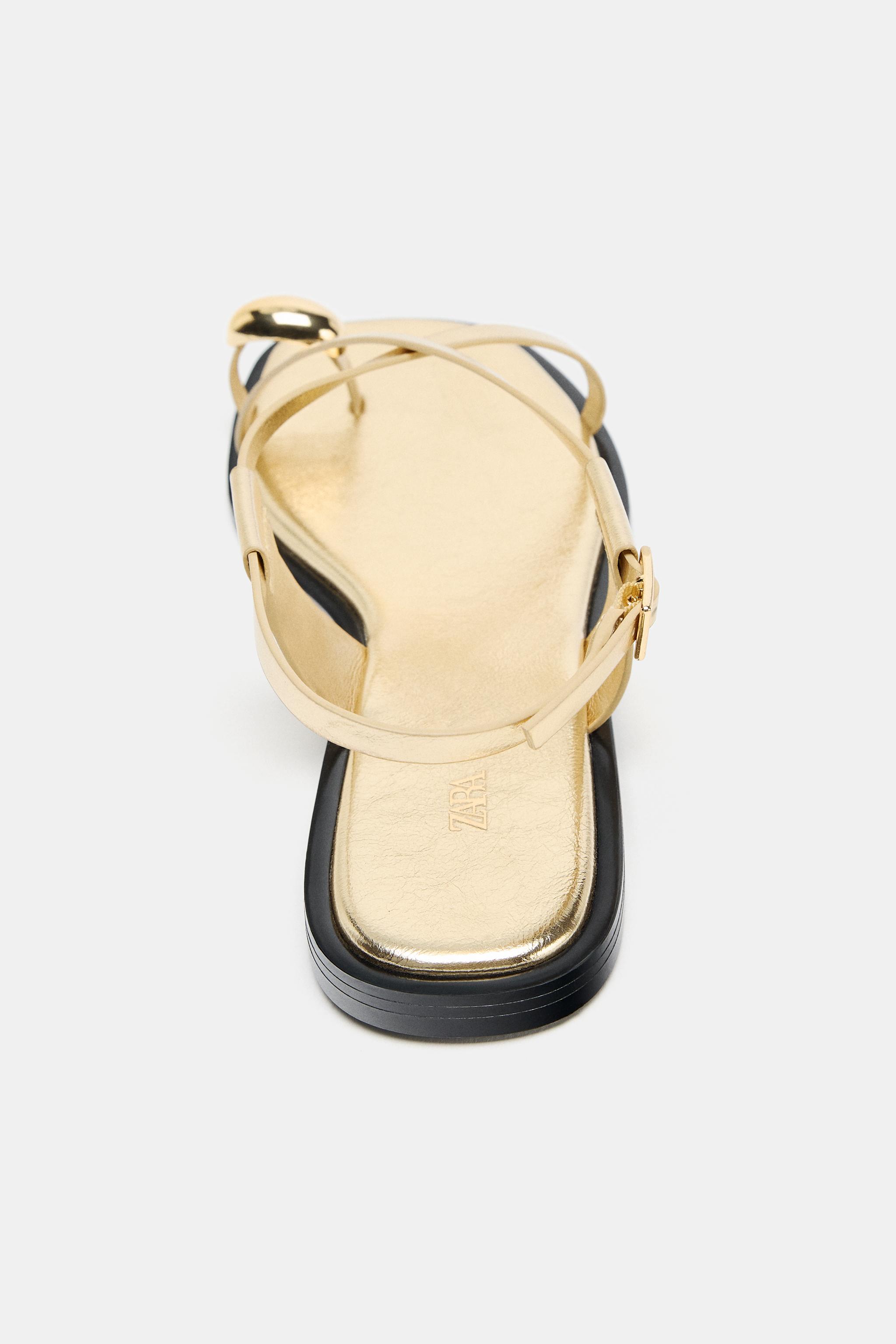 FLAT SANDALS WITH METALLIC DETAIL STRAPS