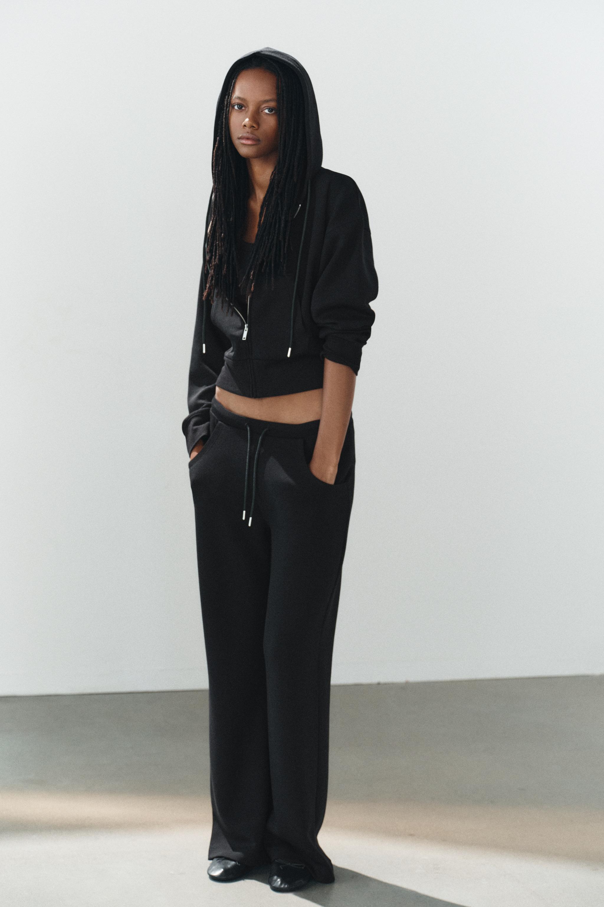 INTERLOCK FLARE PANTS — Black