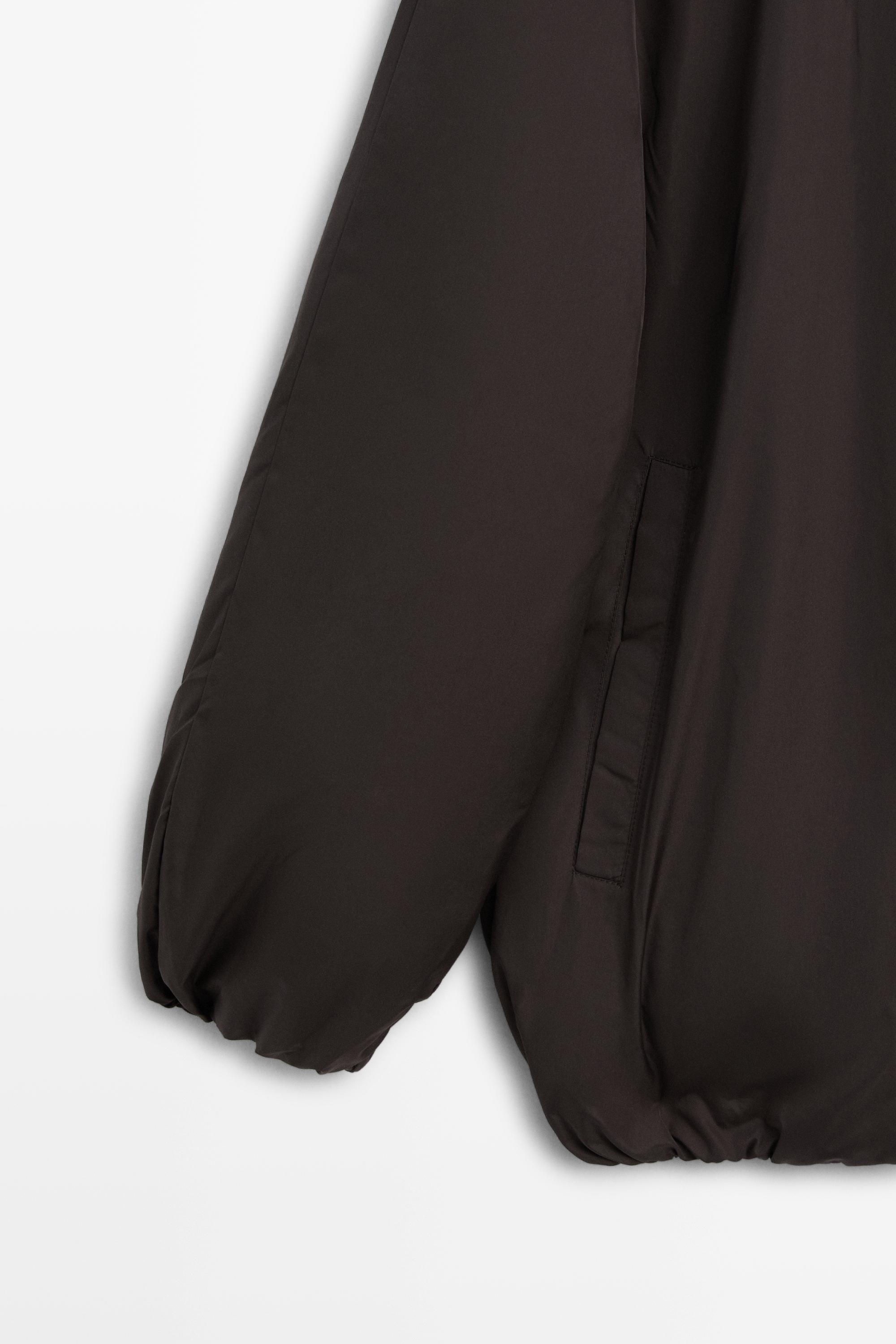 Down jacket with detachable detail piece