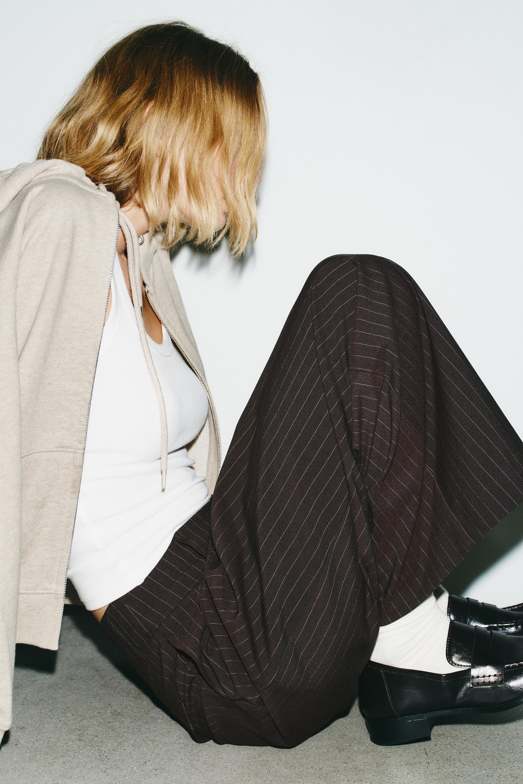 PINSTRIPE PANTS WITH PLEATS AND FLAPS