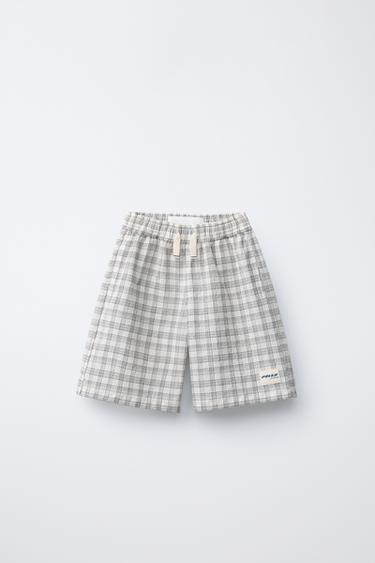 BERMUDAS SEERSUCKER CADROS PUKAS SURF - Cru / Negro de Zara - Imaxe 0