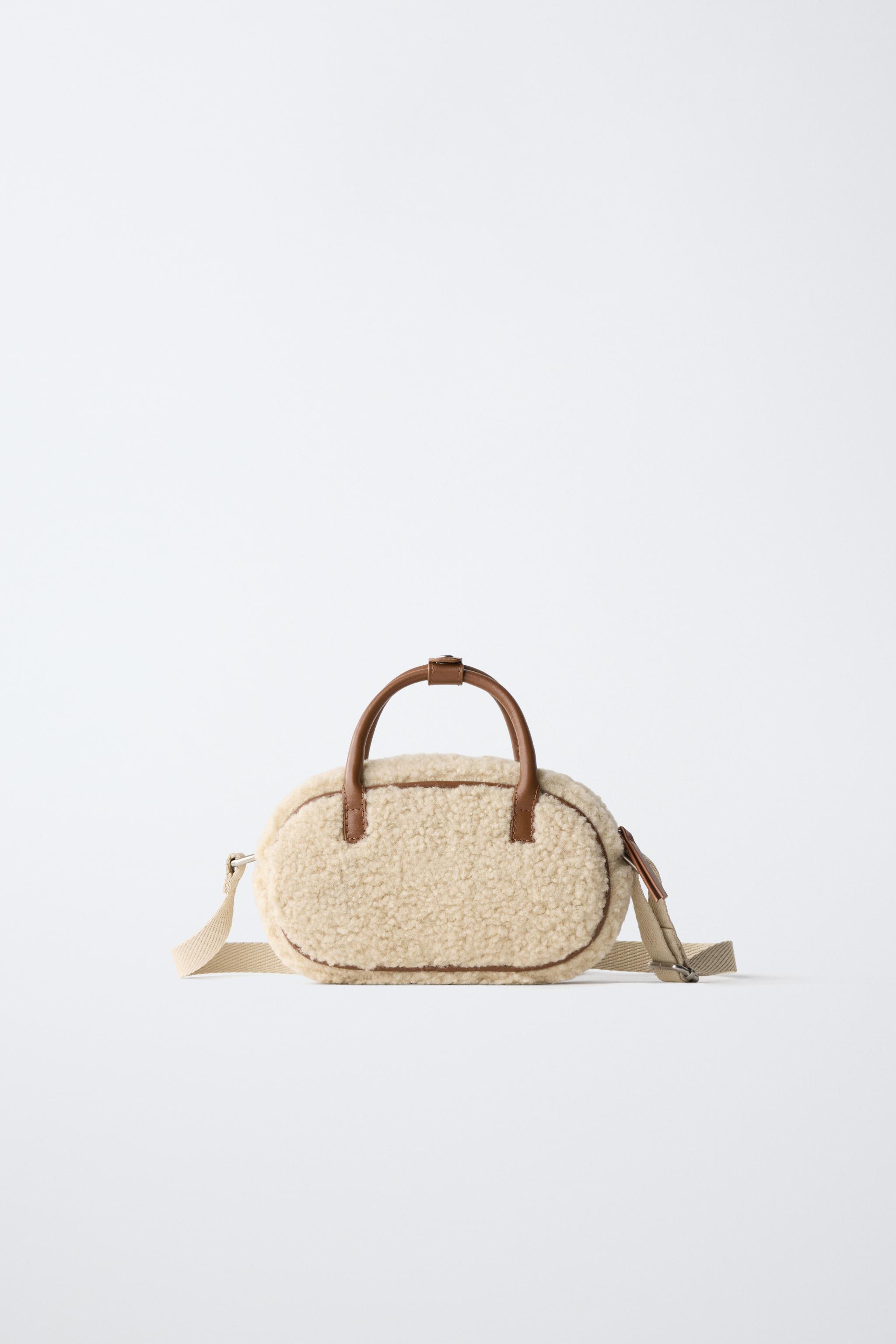 SAC BANDOULIÈRE EN MOUTON RETOURNÉ AVEC PIÈCE