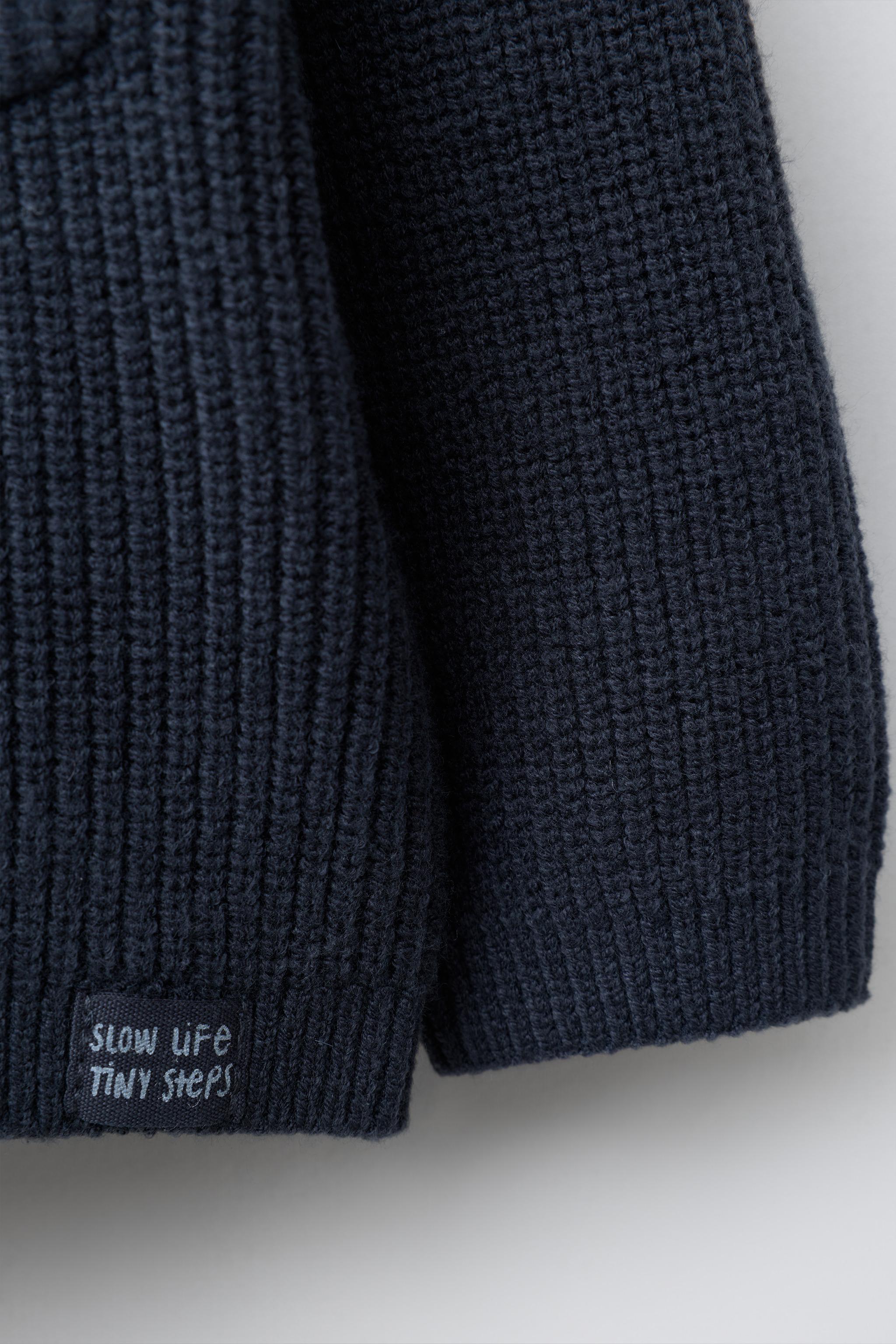 PULL EN MAILLE PERLÉE AVEC POCHE