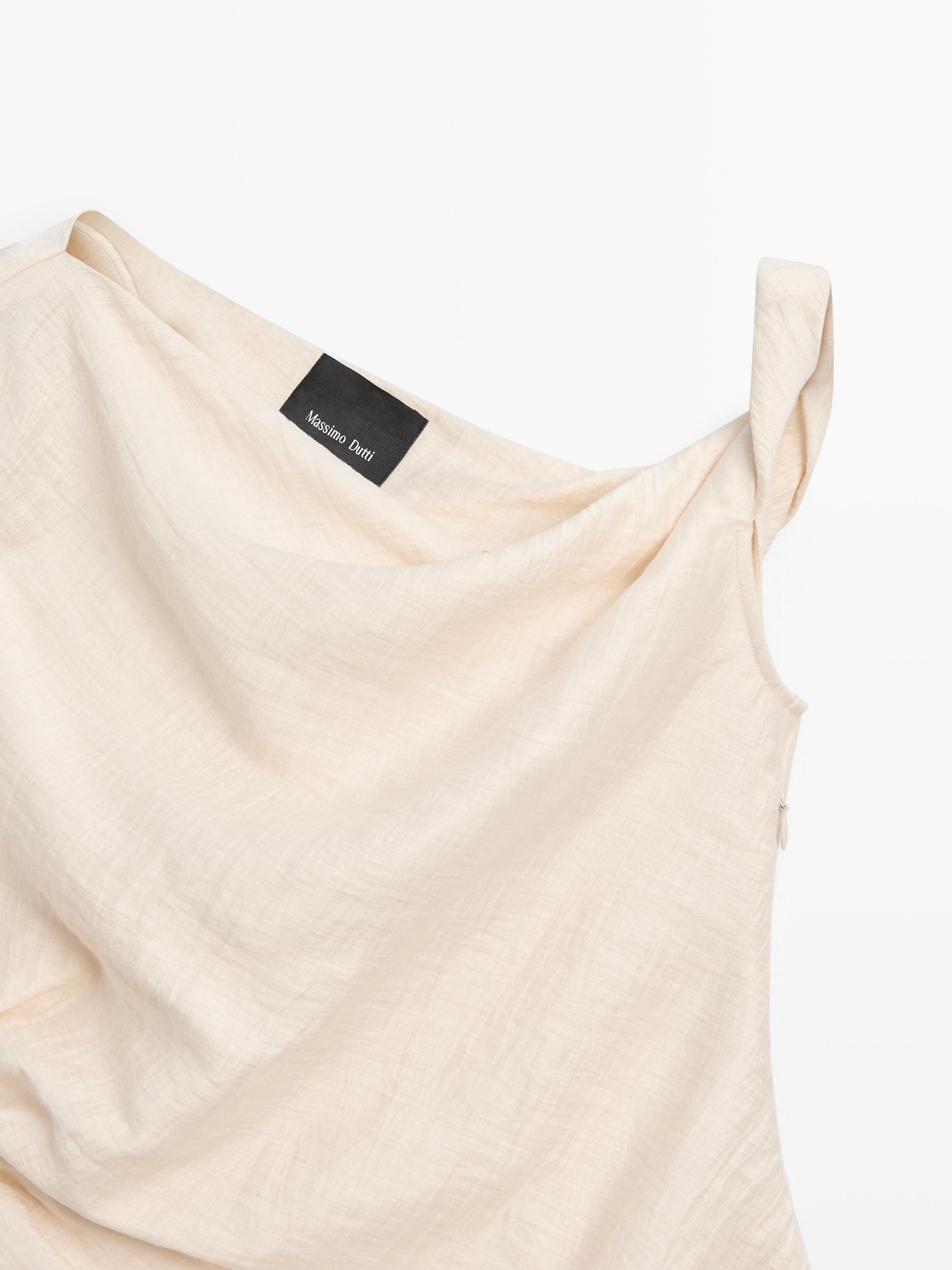 Asymmetric top with knot detail