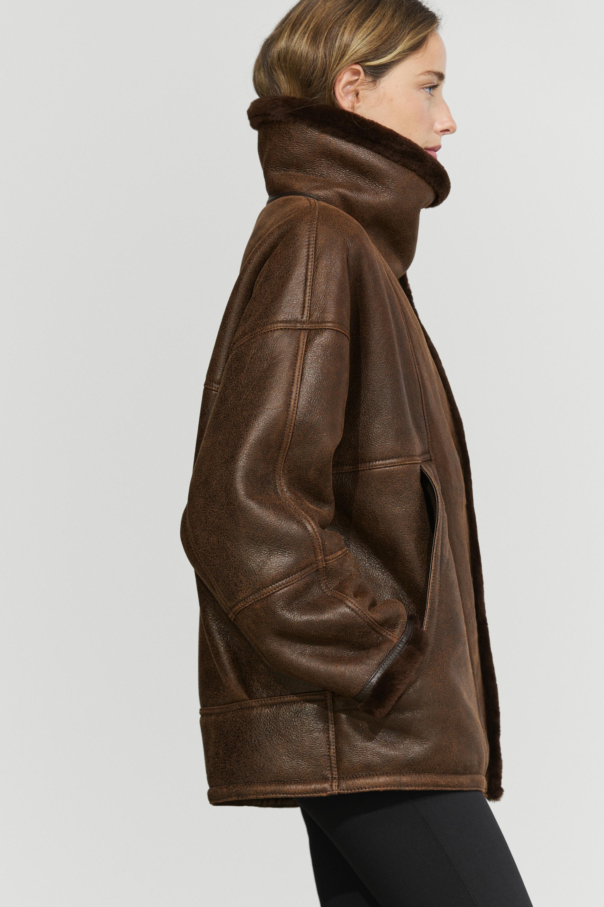 Manteau double face en cuir, daim et fourrure