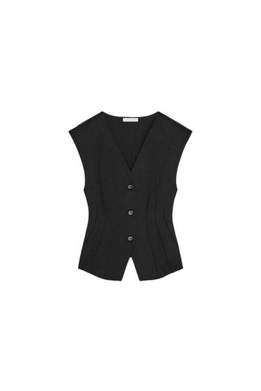 Front view of a black waistcoat with buttons and darts