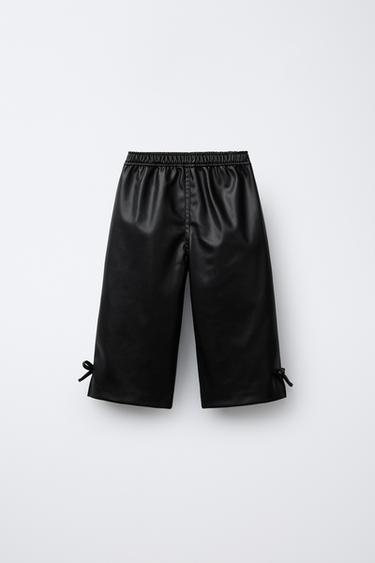 FAUX LEATHER STRAIGHT-LEG TROUSERS WITH BOWS - Black by Zara - Image 1