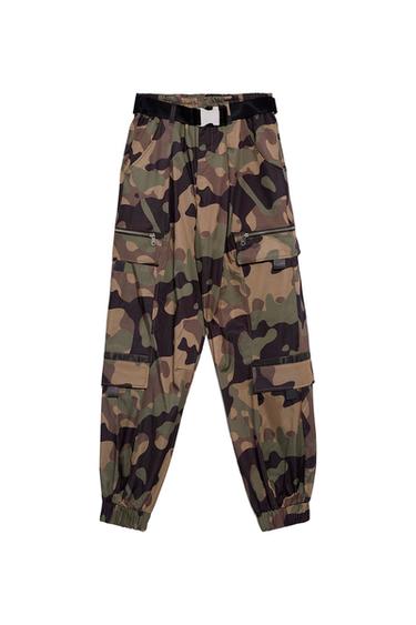Green and brown camouflage cargo trousers with multiple pockets and a black belt. White background.