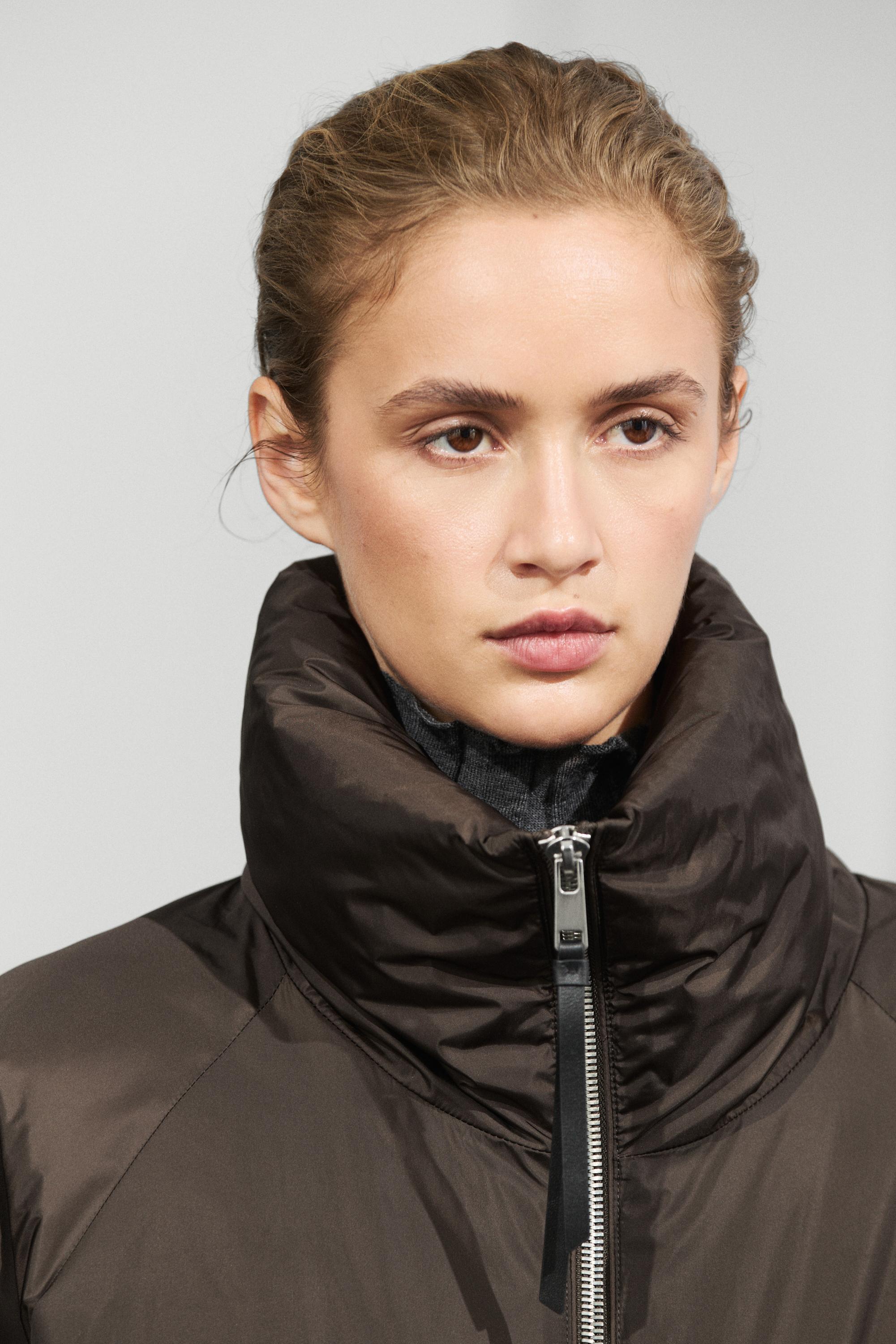 Down jacket with gathered detail