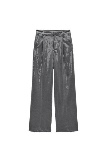 Front view of silver wide-leg trousers with pleats and sheen.