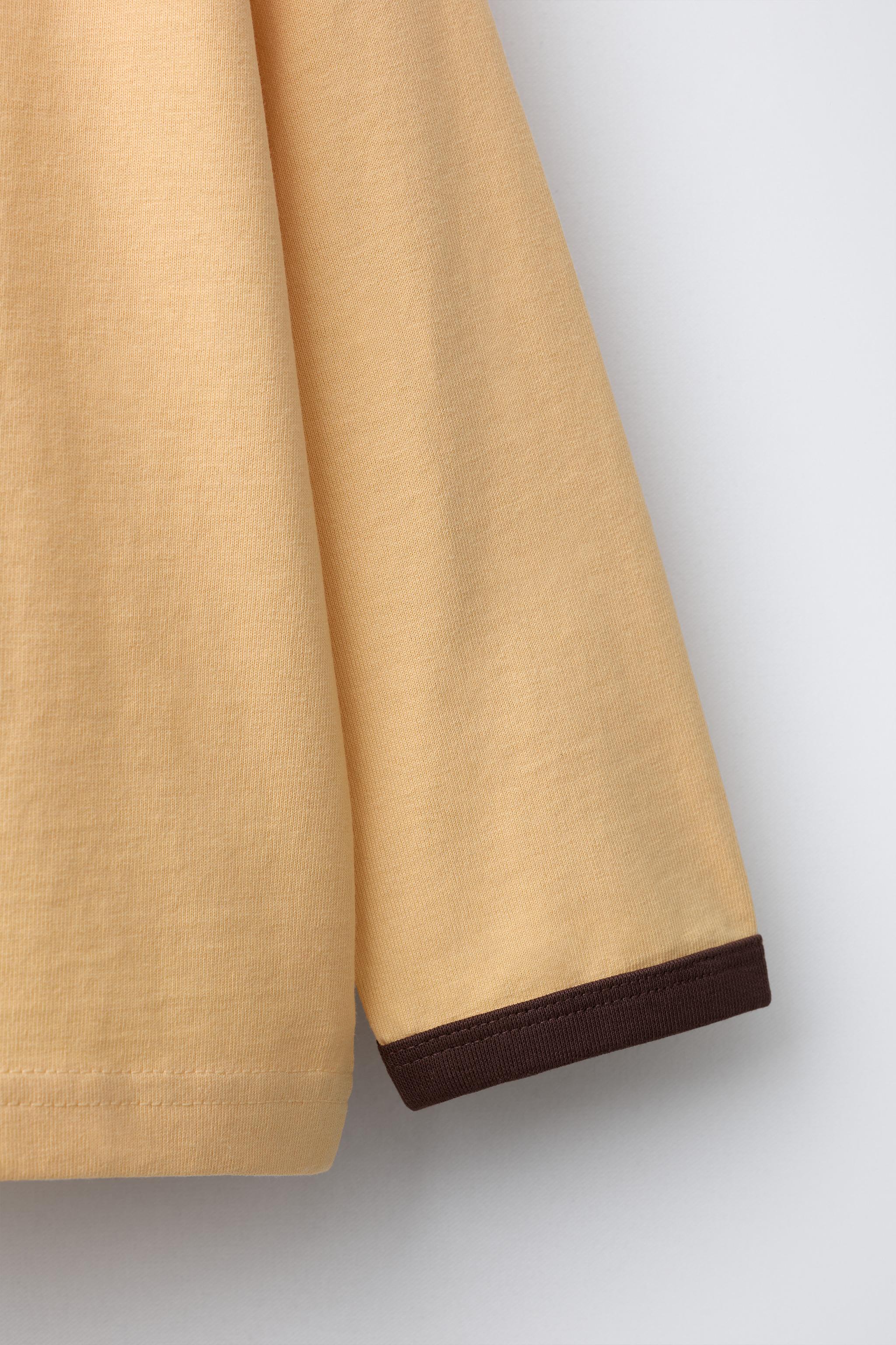 PLAIN T-SHIRT WITH CONTRASTING PIPING AT NECKLINE