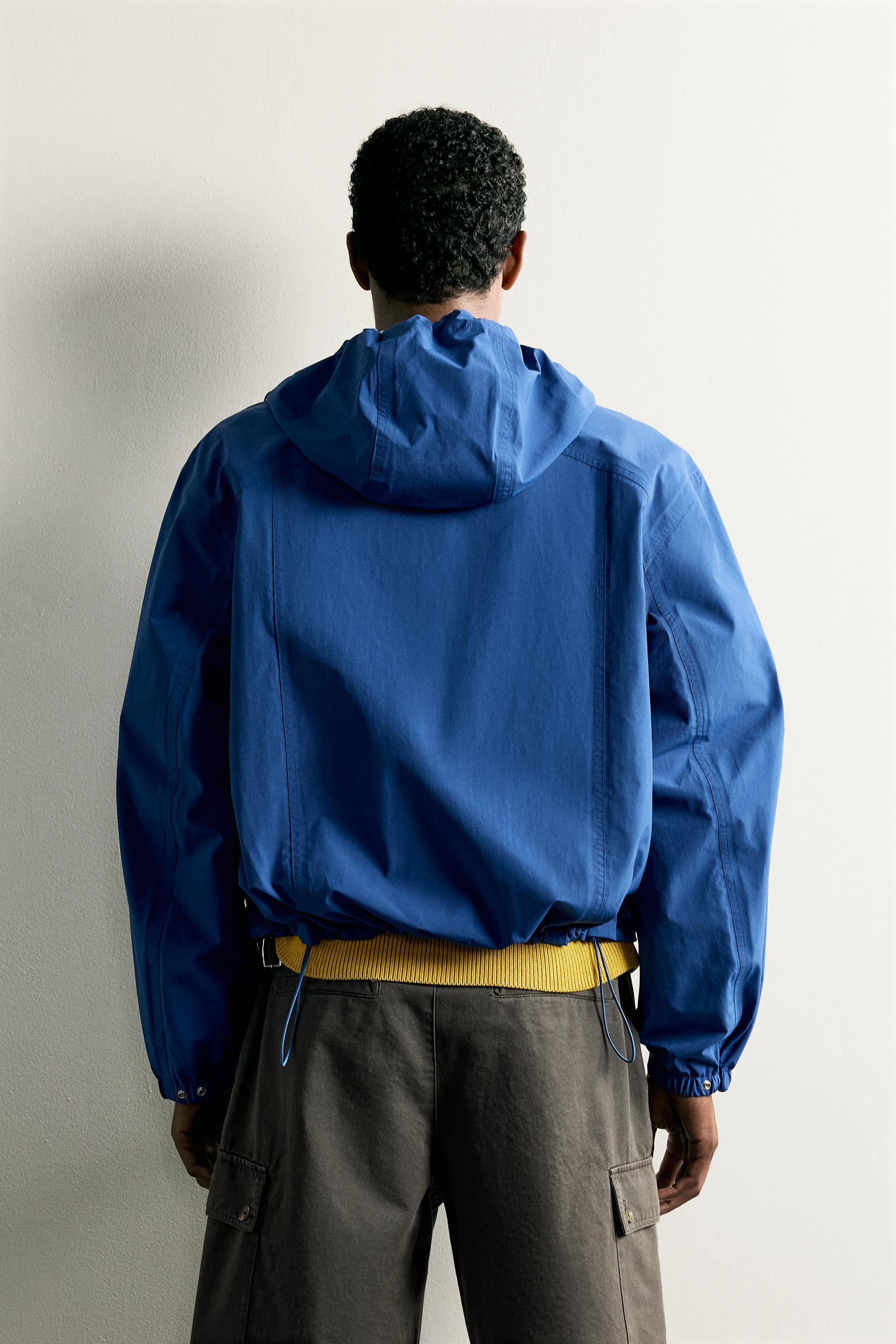 RELAXED FIT HOODED TECHNICAL JACKET