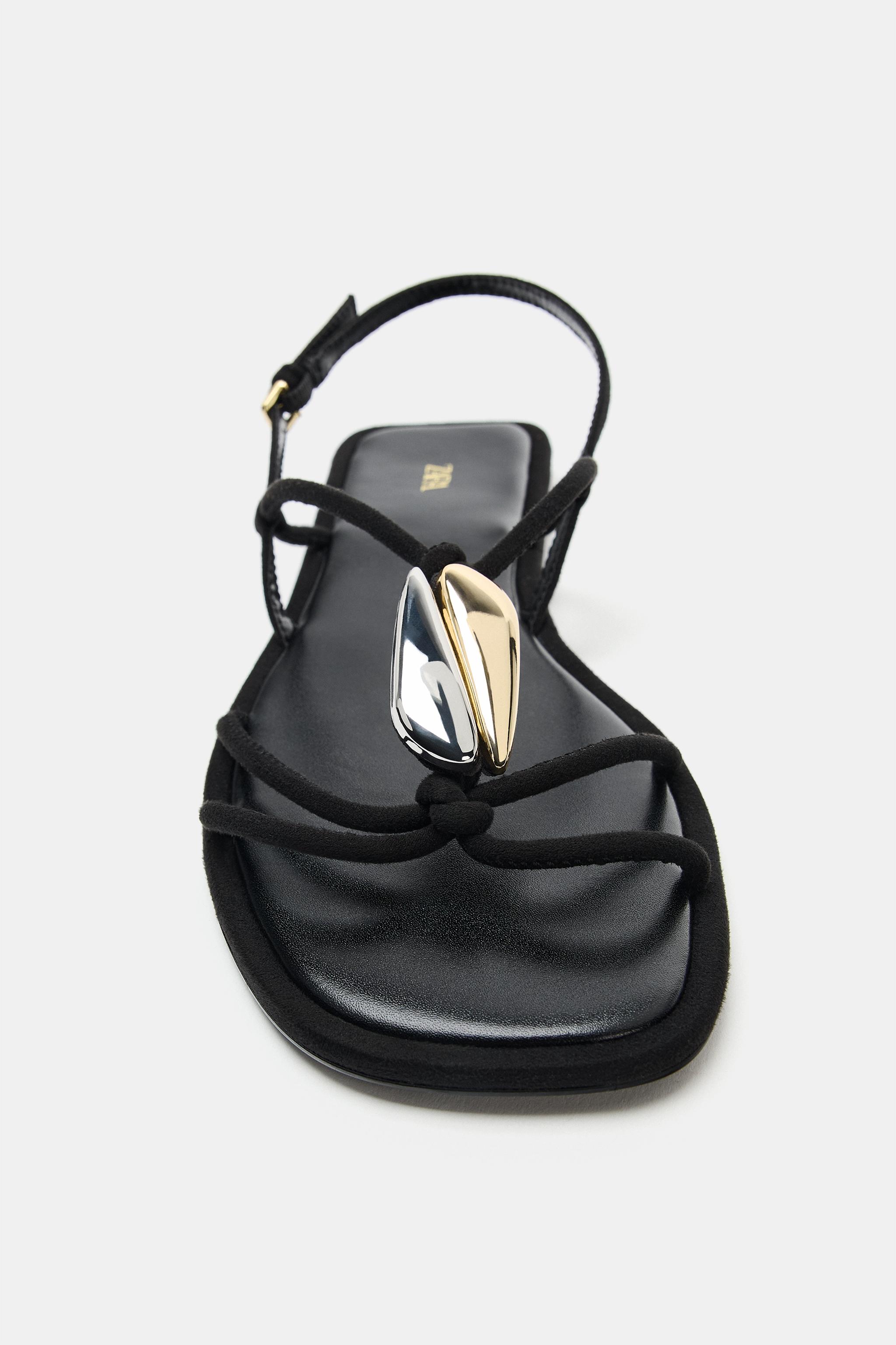 FLAT SANDALS WITH METALLIC APPLIQUÉ