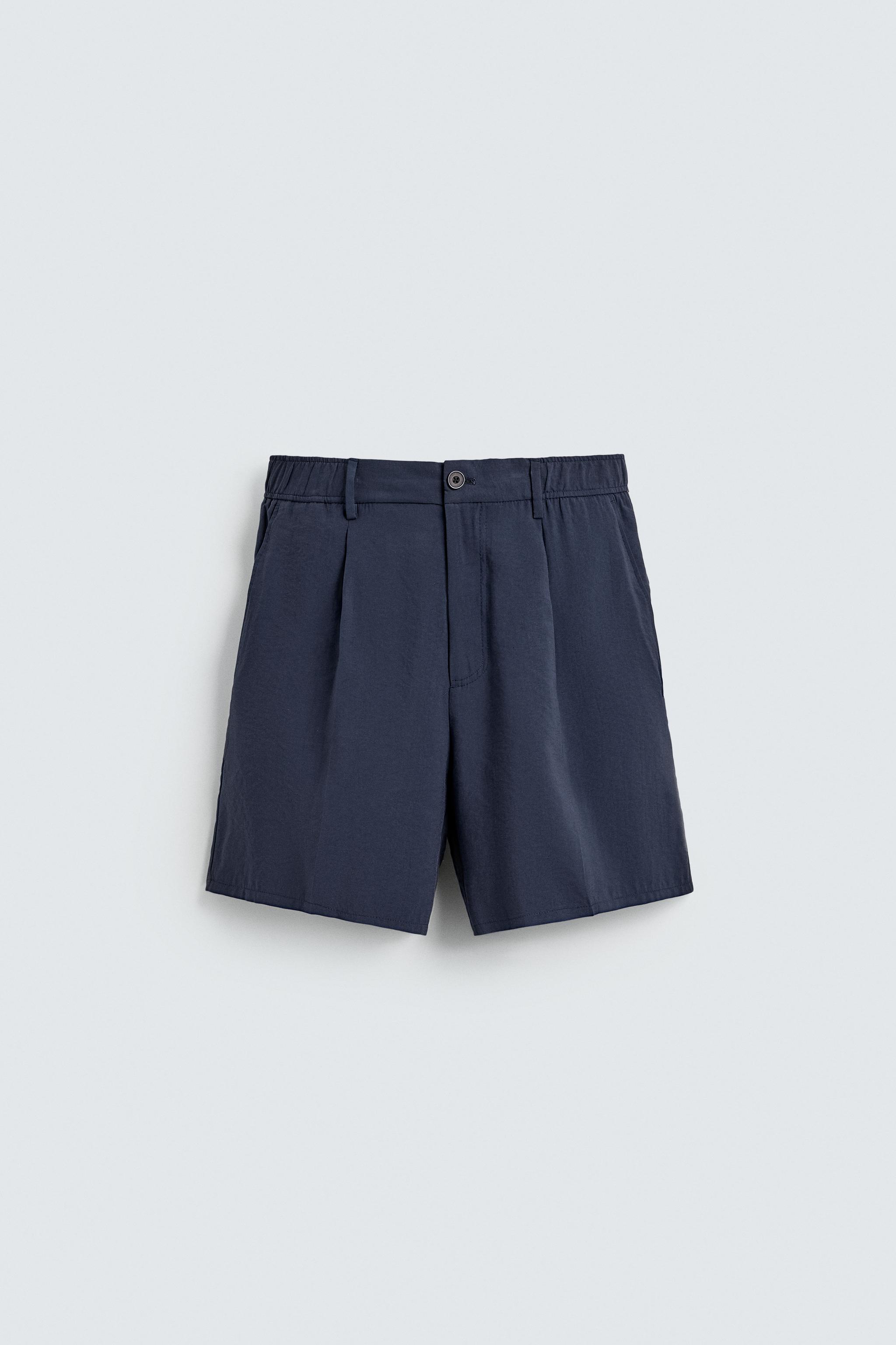 SOFT PLEATED LOOSE-FITTING BERMUDA SHORTS — Navy blue