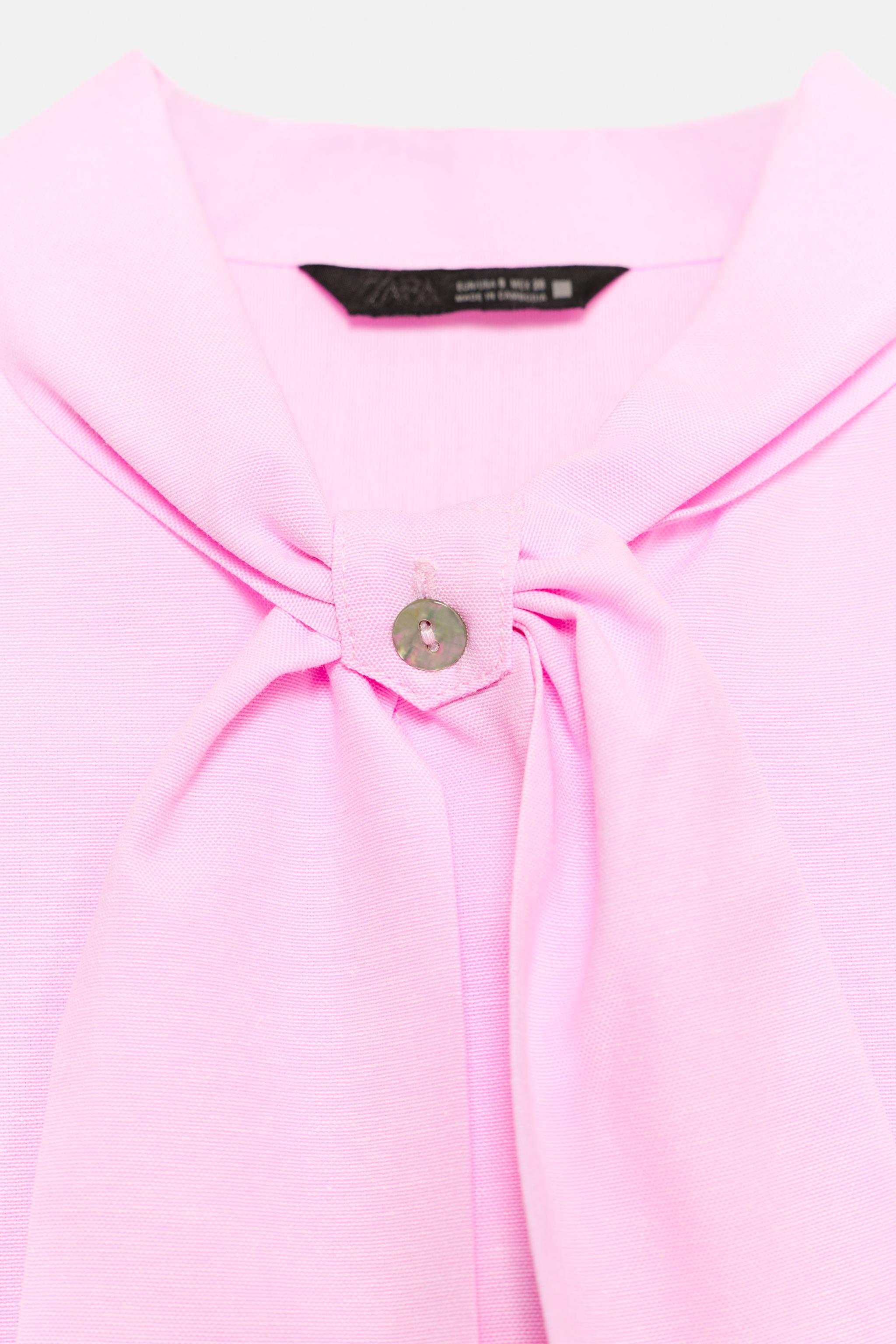 SLEEVELESS BOW BLOUSE